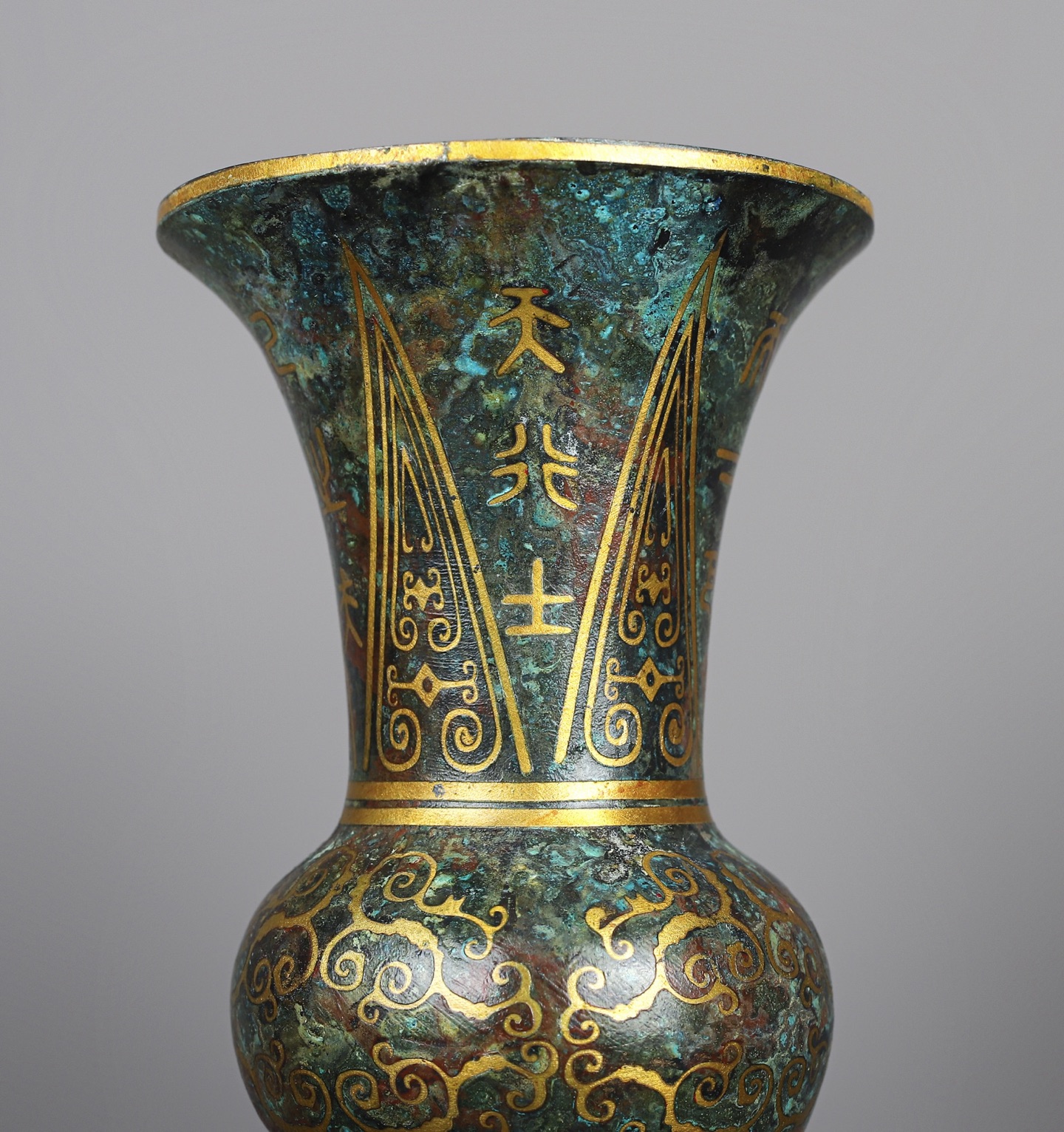 Han Dynasty A pair of bronze and gold round statues