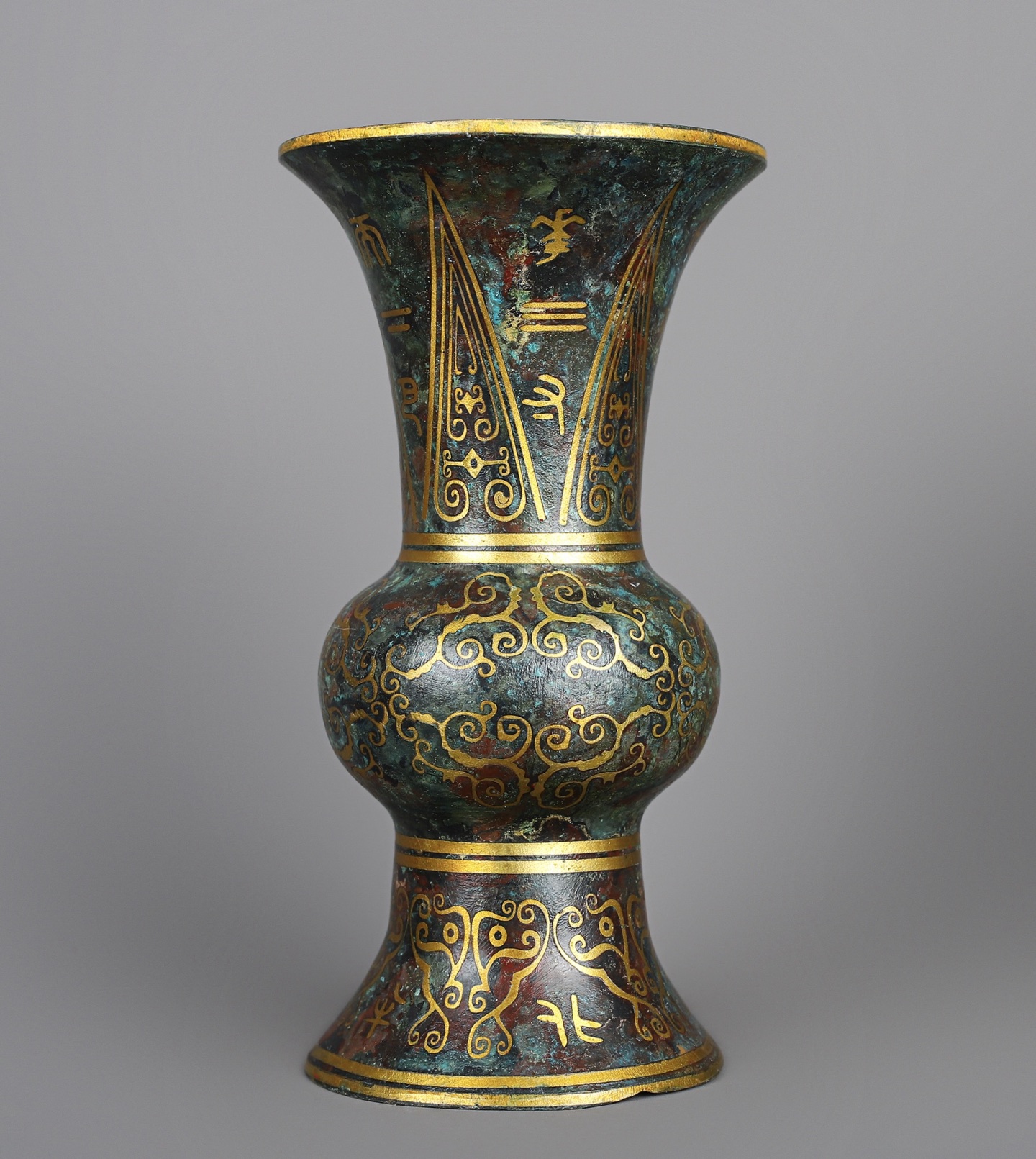 Han Dynasty A pair of bronze and gold round statues