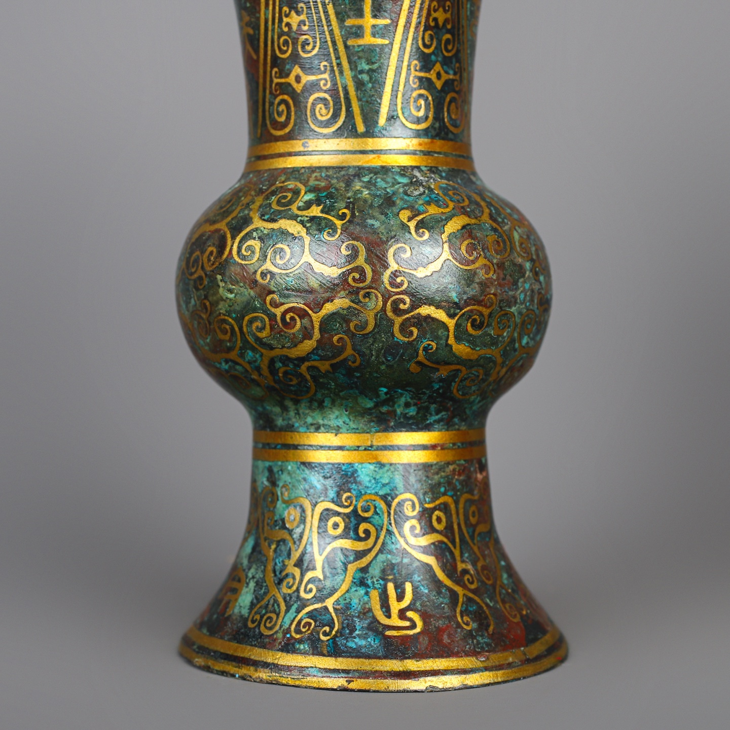 Han Dynasty A pair of bronze and gold round statues