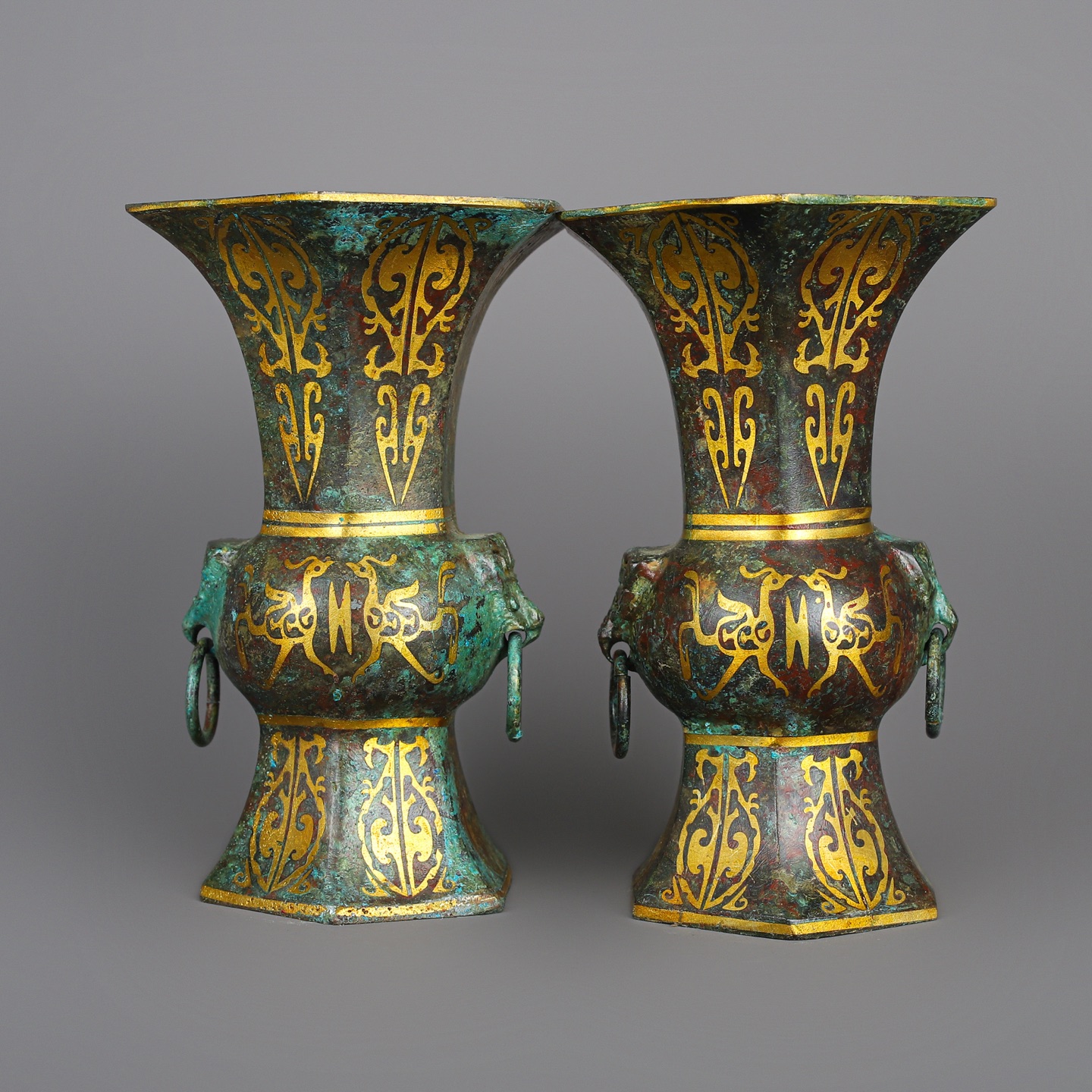 Han Dynasty A pair of bronze and gold six edged statues