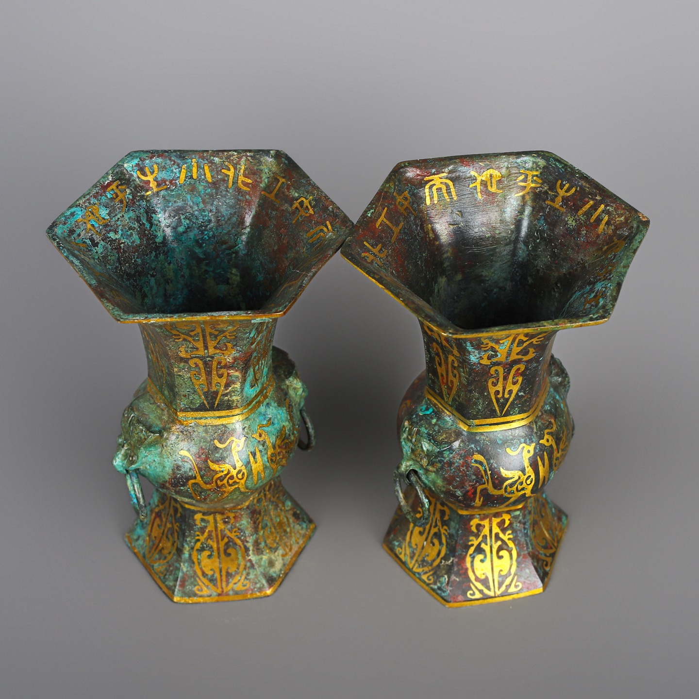 Han Dynasty A pair of bronze and gold six edged statues