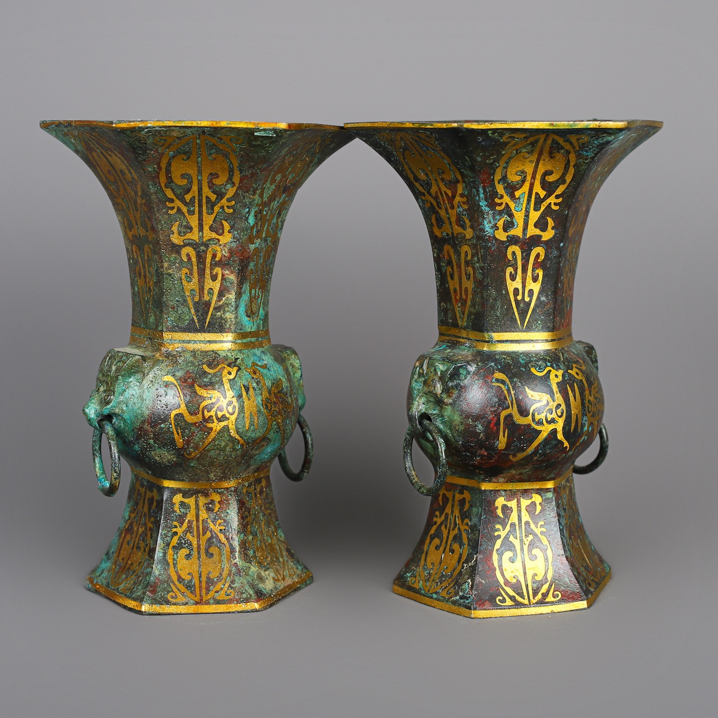 Han Dynasty A pair of bronze and gold six edged statues