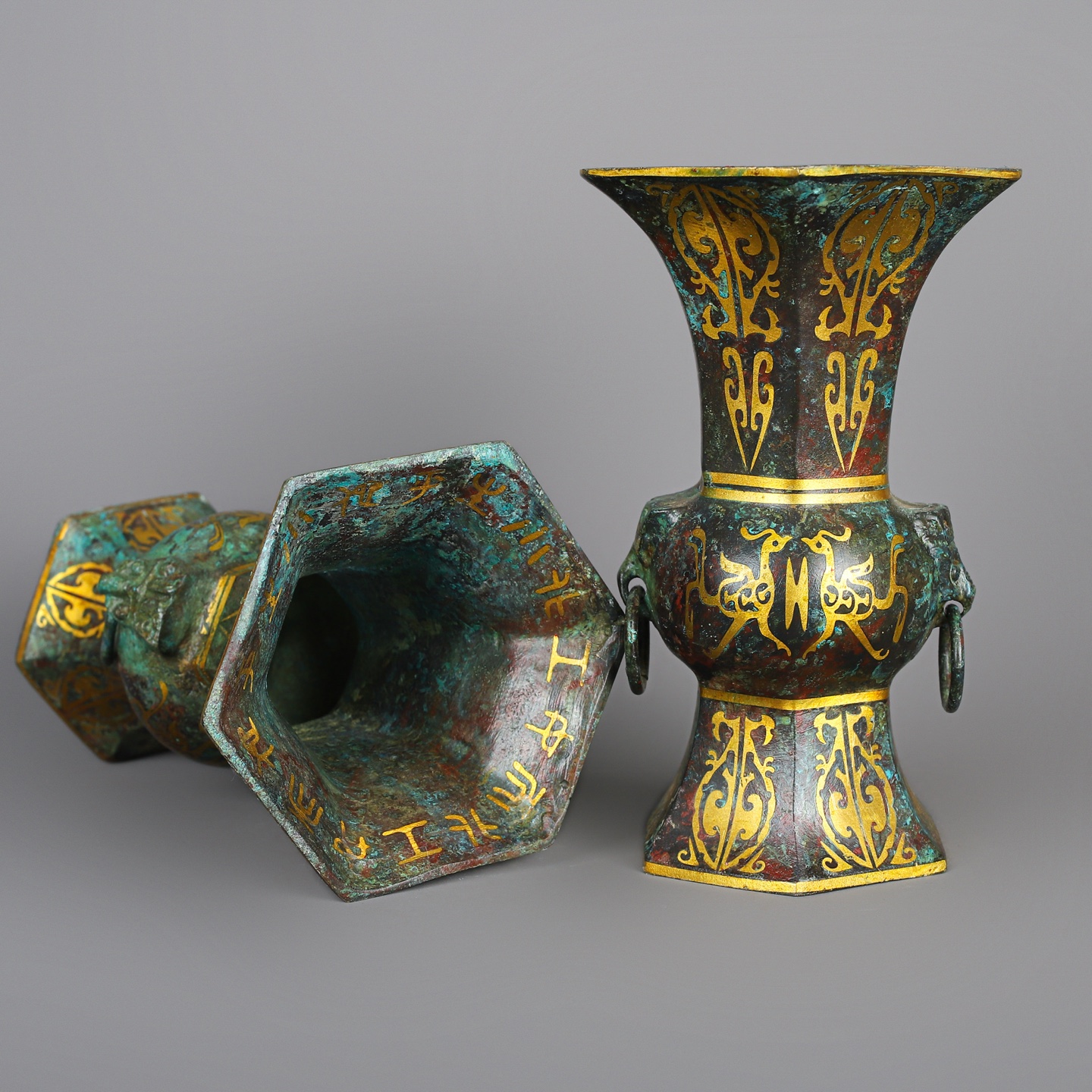 Han Dynasty A pair of bronze and gold six edged statues