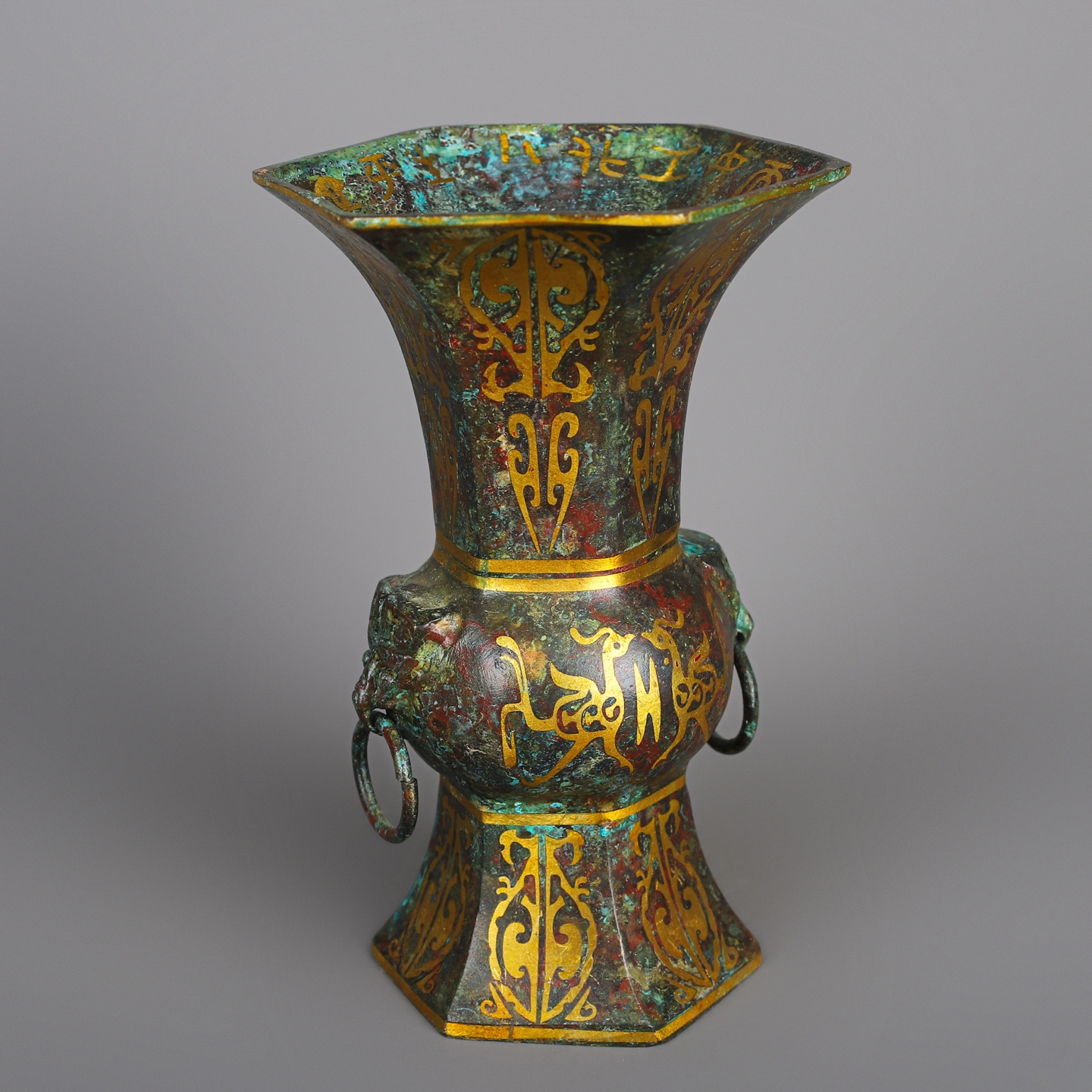 Han Dynasty A pair of bronze and gold six edged statues