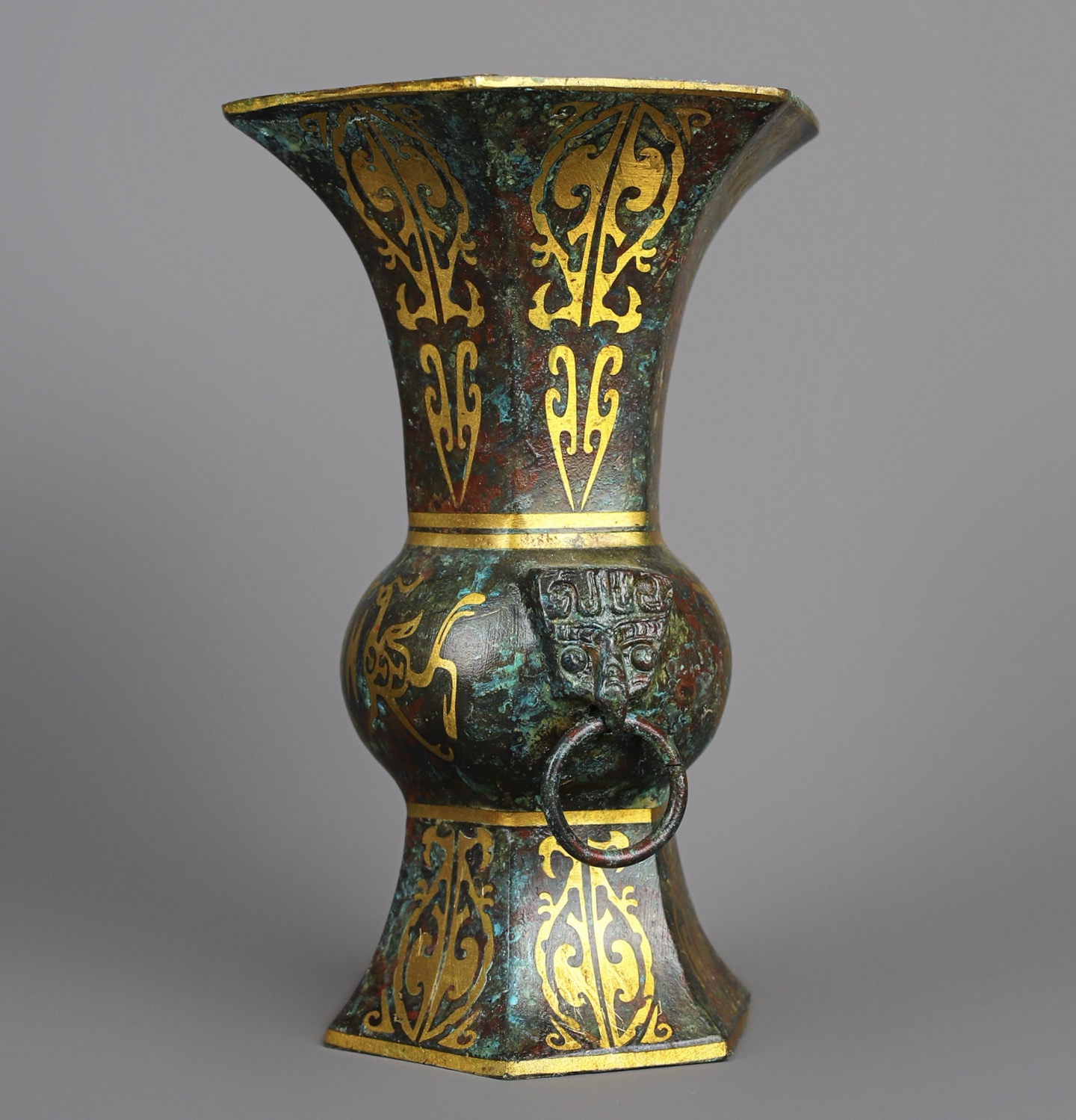 Han Dynasty A pair of bronze and gold six edged statues