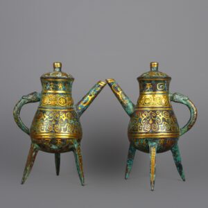 Han Dynasty Pair of bronze and gold three legged wine bottles