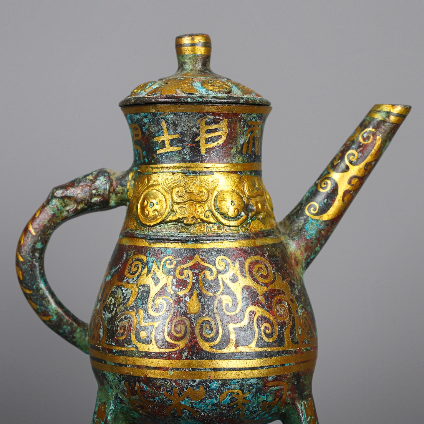 Han Dynasty Pair of bronze and gold three legged wine bottles