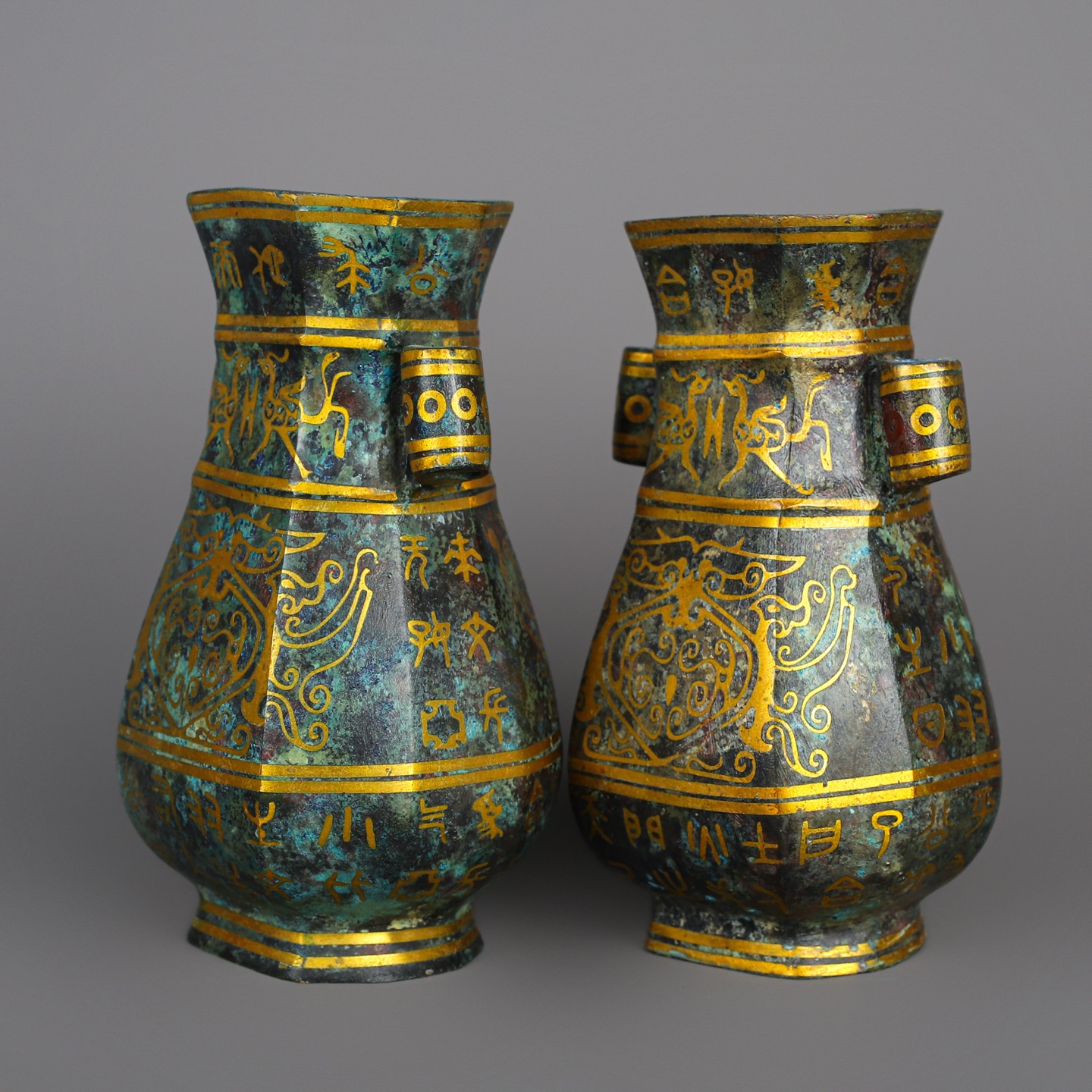 Han Dynasty Pair of bronze and gold double eared square vases