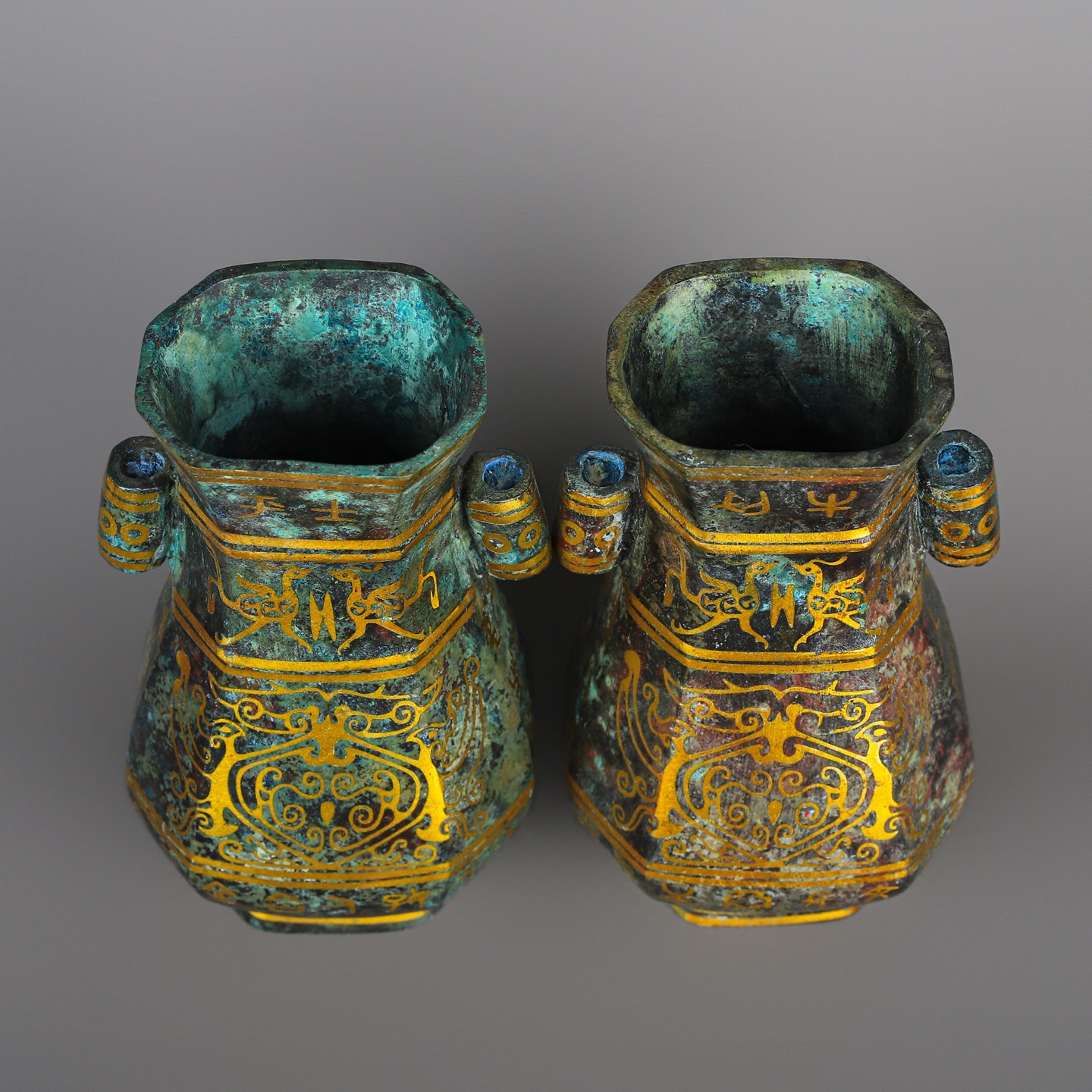Han Dynasty Pair of bronze and gold double eared square vases