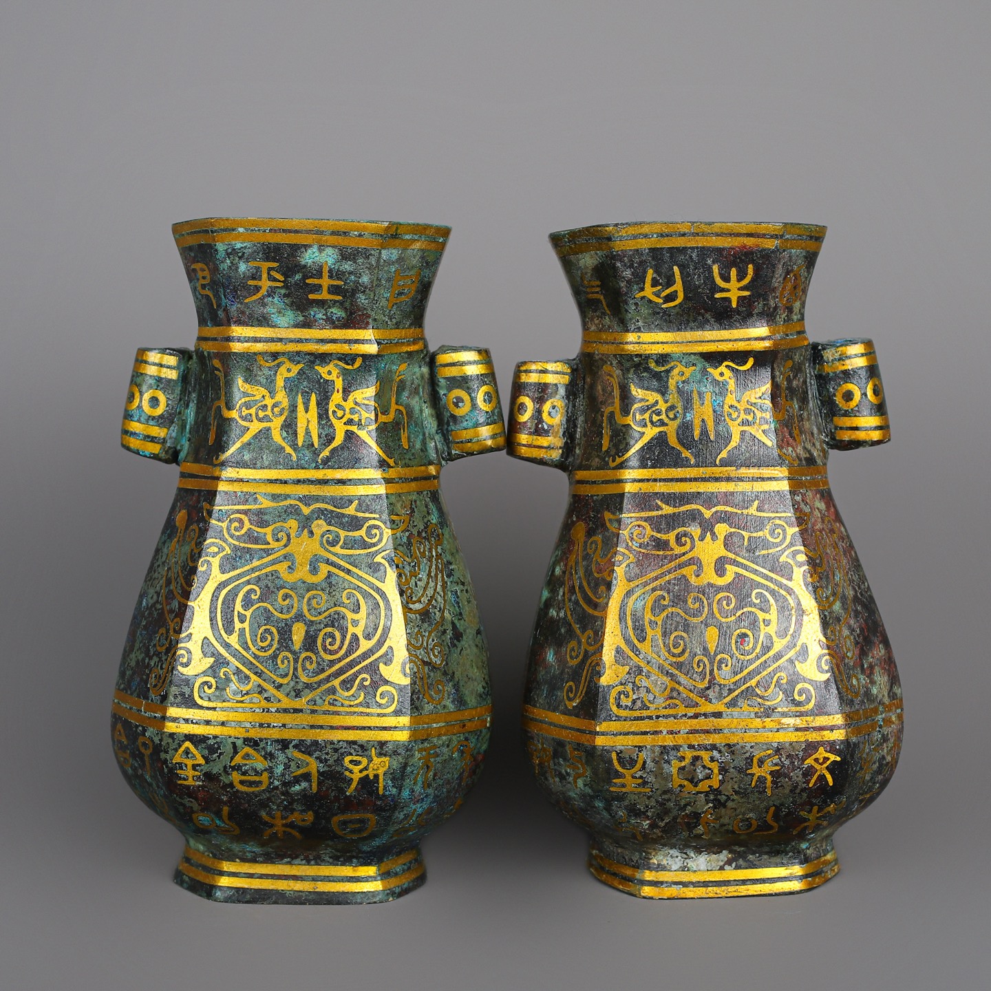 Han Dynasty Pair of bronze and gold double eared square vases