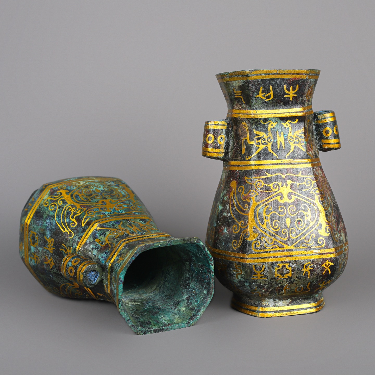 Han Dynasty Pair of bronze and gold double eared square vases