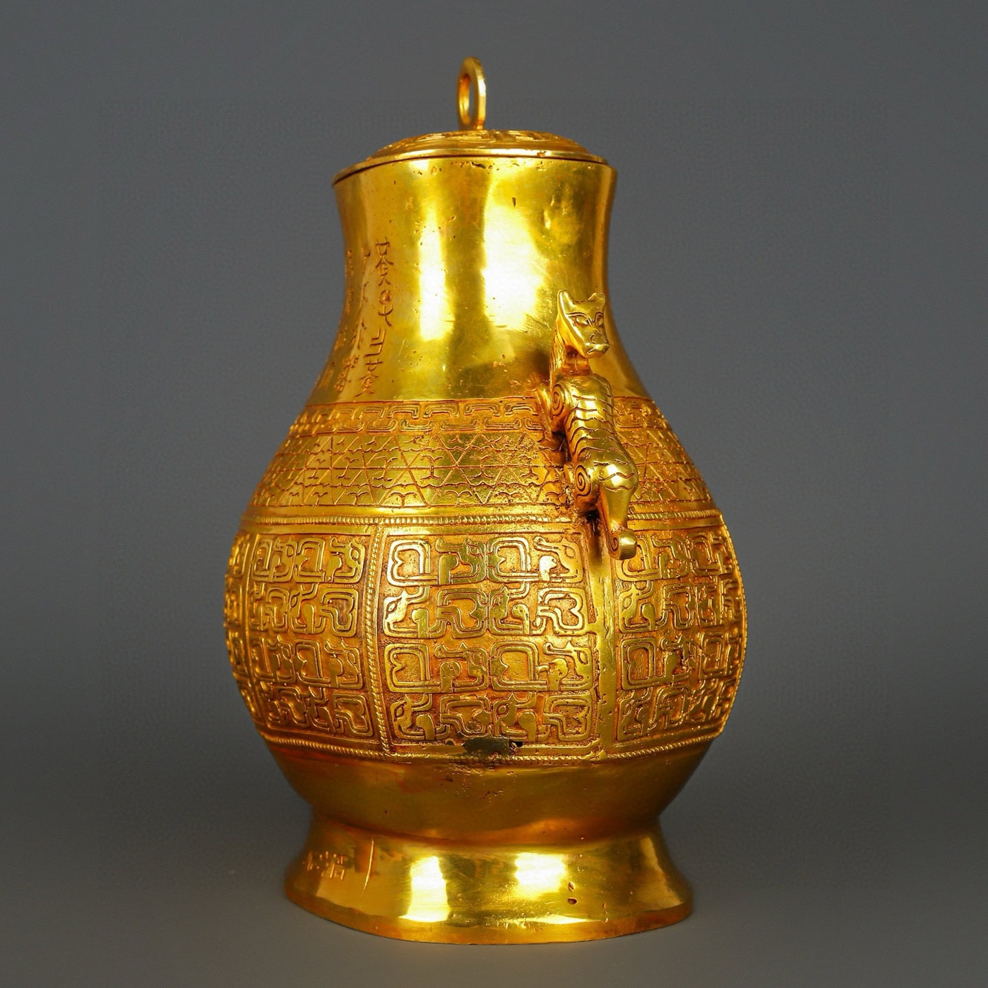 Han Dynasty gilt bronze and gold double dragon bottle