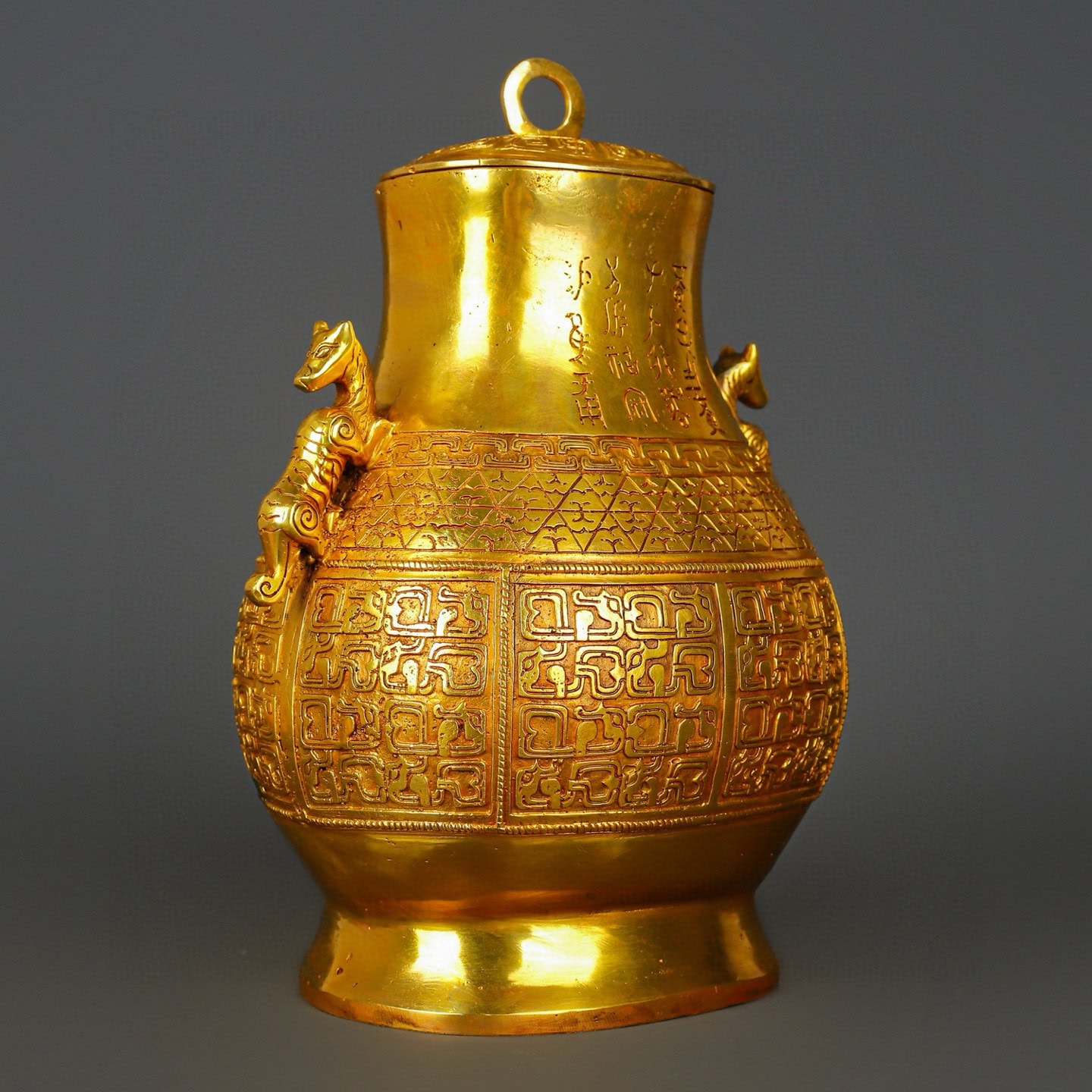 Han Dynasty gilt bronze and gold double dragon bottle