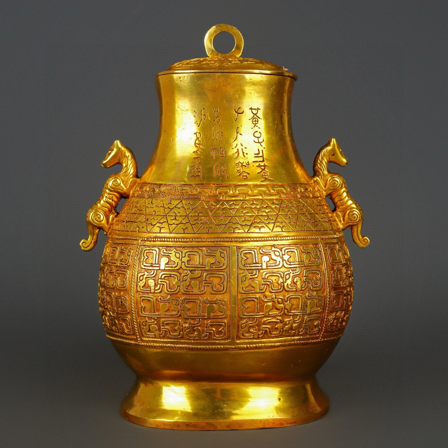 Han Dynasty gilt bronze and gold double dragon bottle