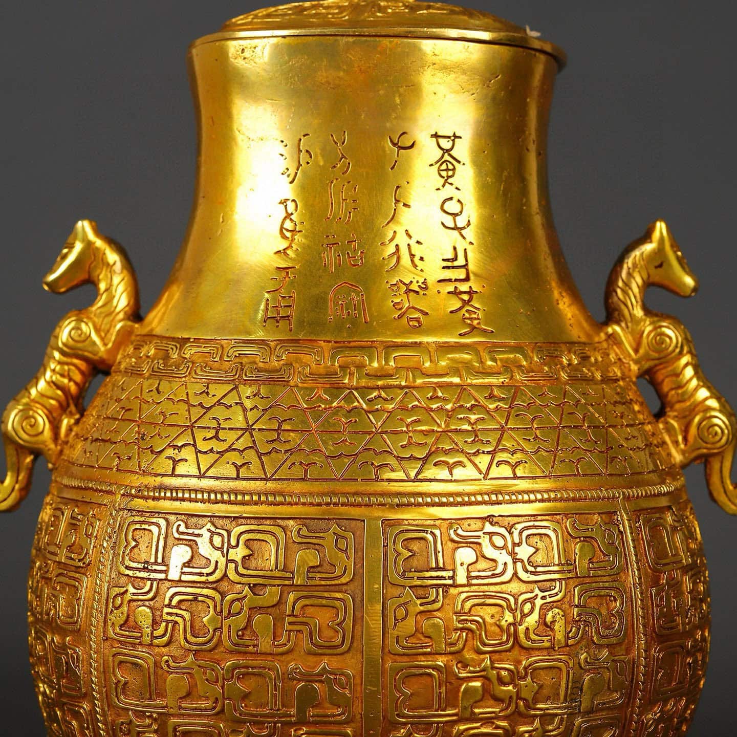 Han Dynasty gilt bronze and gold double dragon bottle