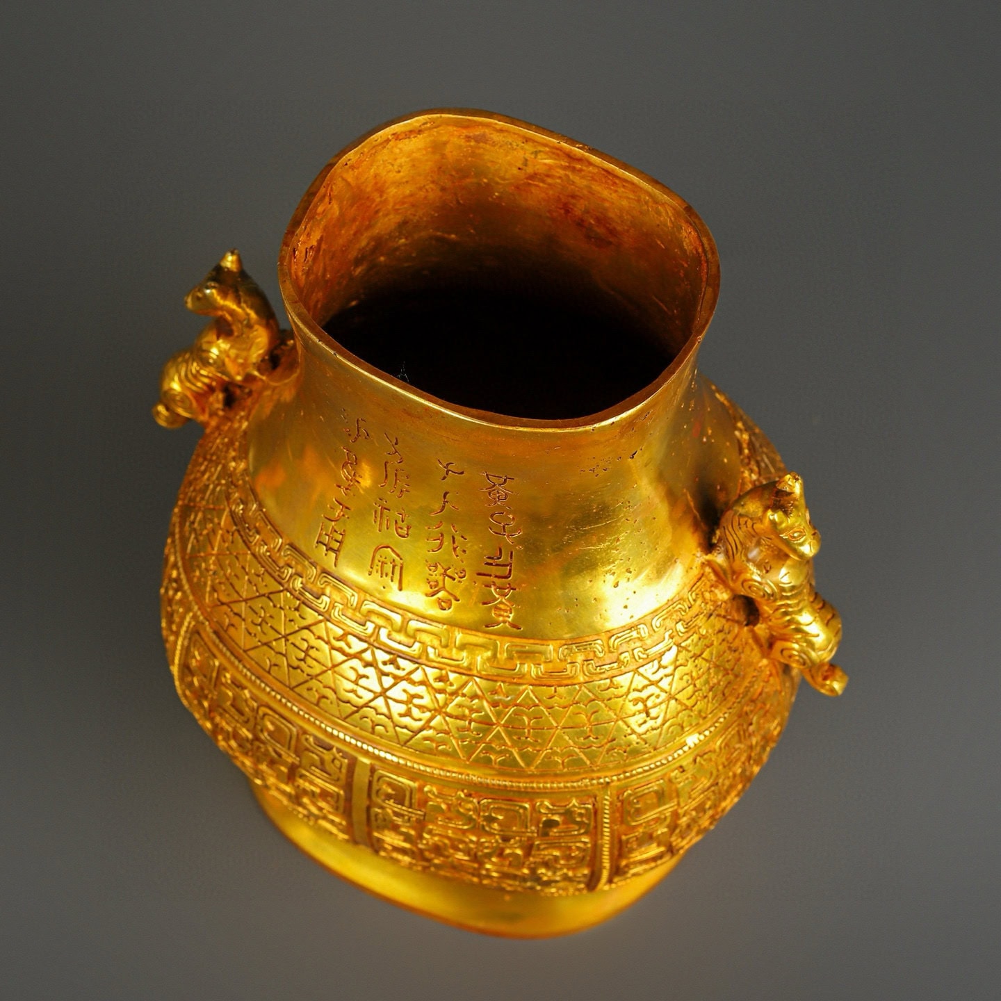Han Dynasty gilt bronze and gold double dragon bottle
