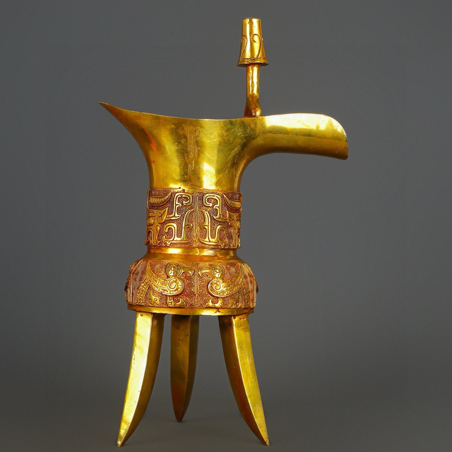Han Dynasty gilt bronze and real gold three legged cup