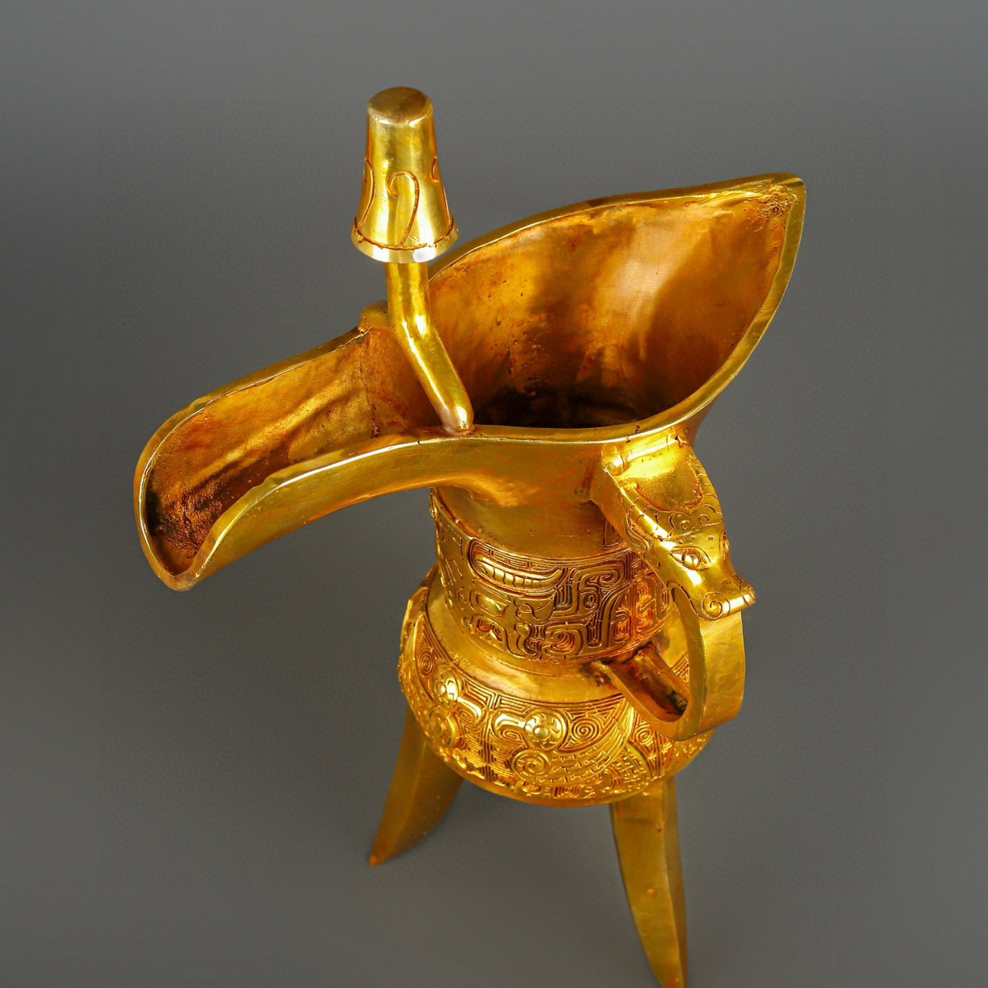 Han Dynasty gilt bronze and real gold three legged cup