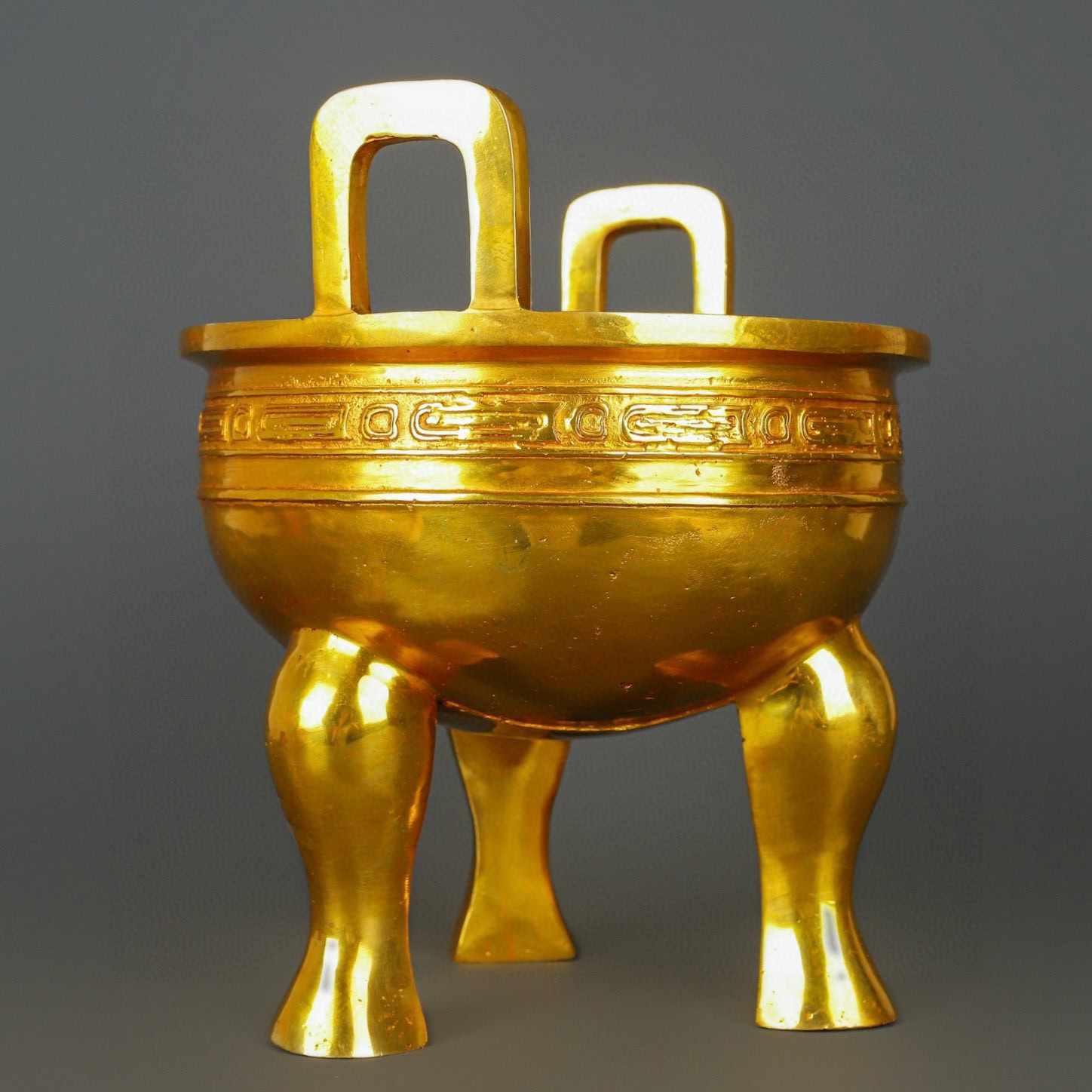 Zhou Dynasty Bronze gilt gold haired male tripod