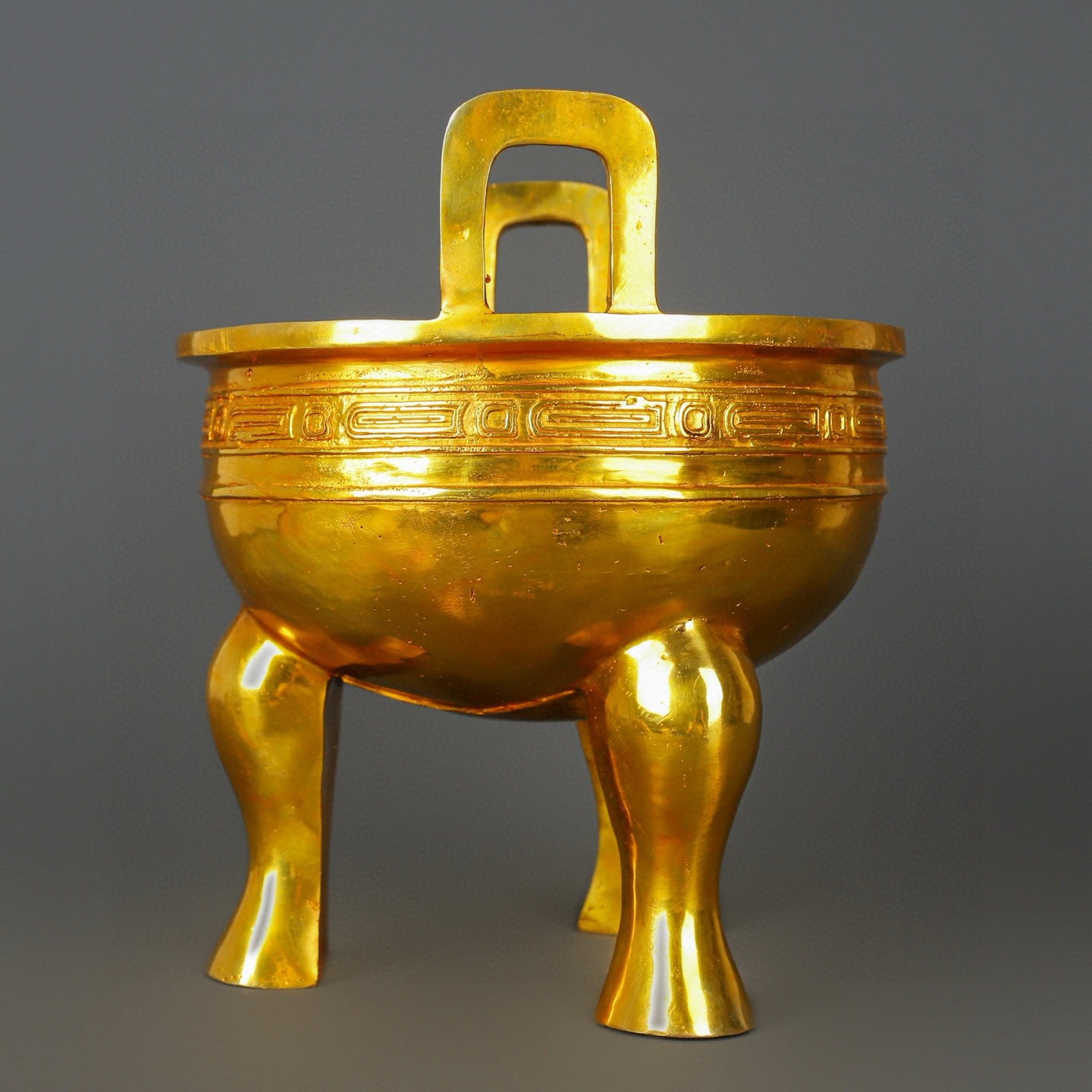 Zhou Dynasty Bronze gilt gold haired male tripod