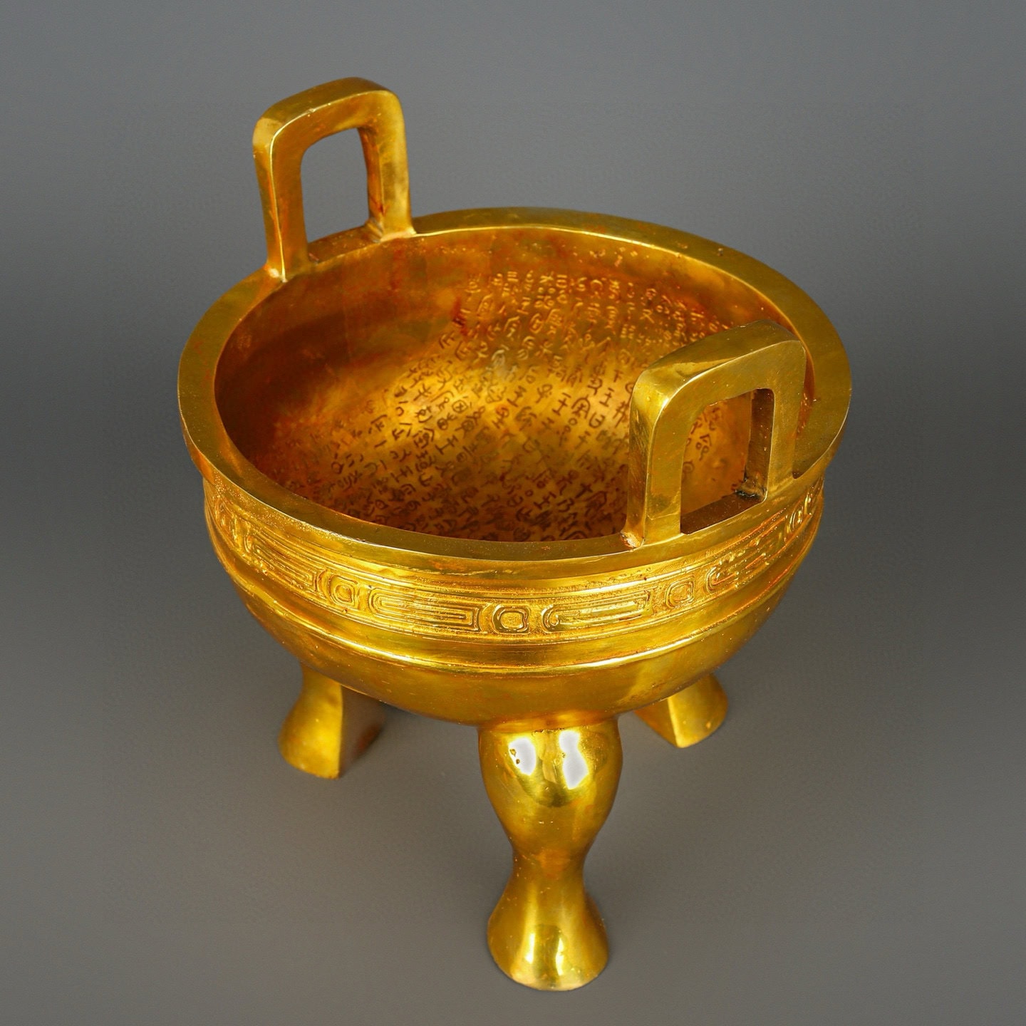 Zhou Dynasty Bronze gilt gold haired male tripod