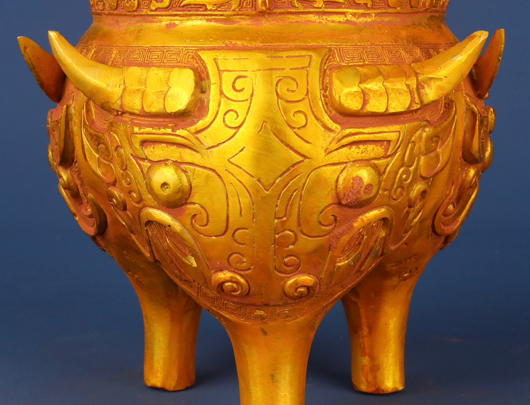 Zhou Dynasty Bronze gilt animal faced tripod