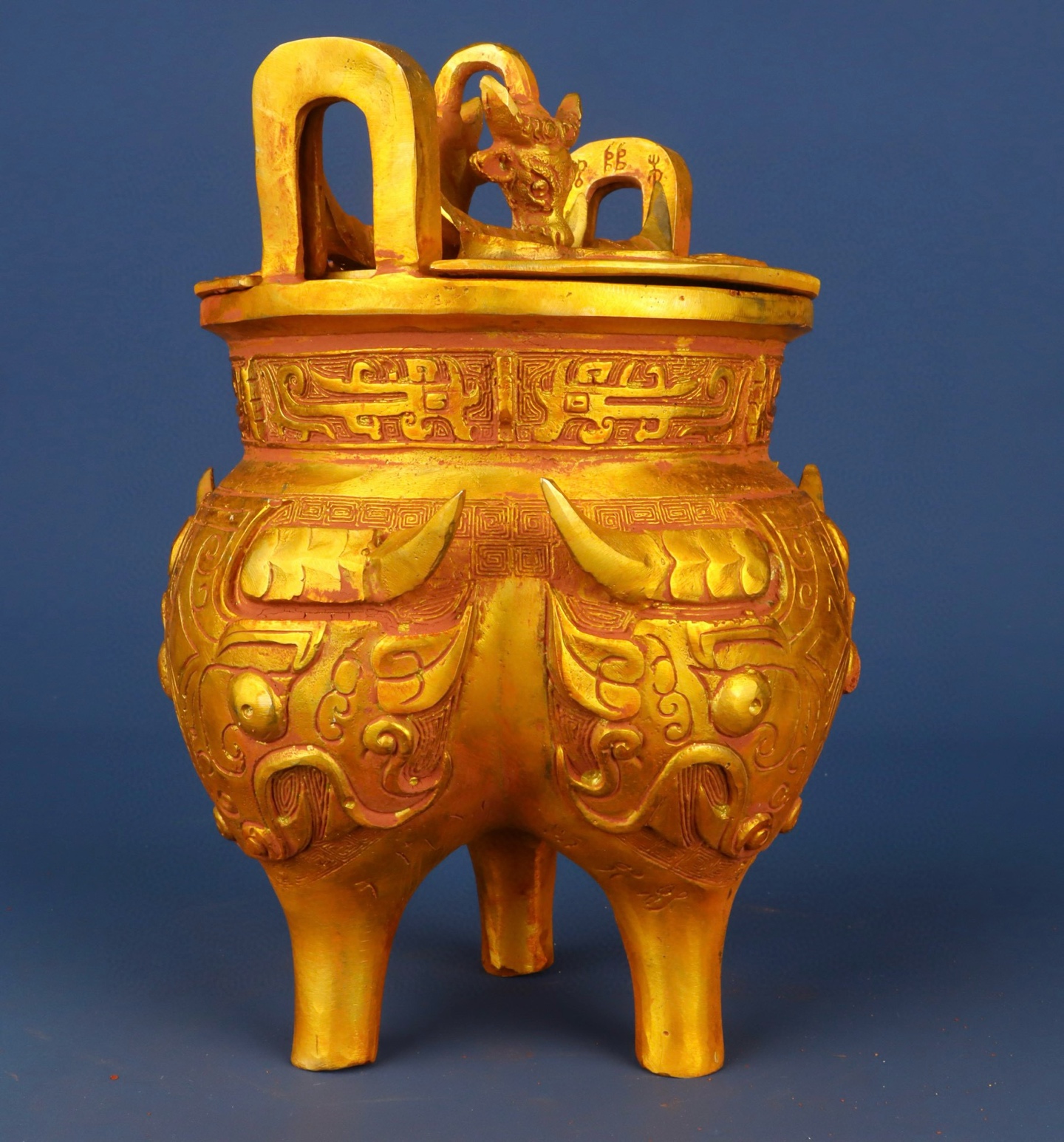 Zhou Dynasty Bronze gilt animal faced tripod