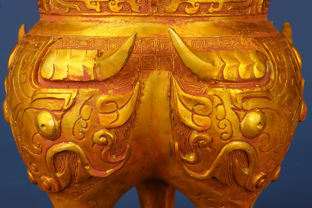 Zhou Dynasty Bronze gilt animal faced tripod