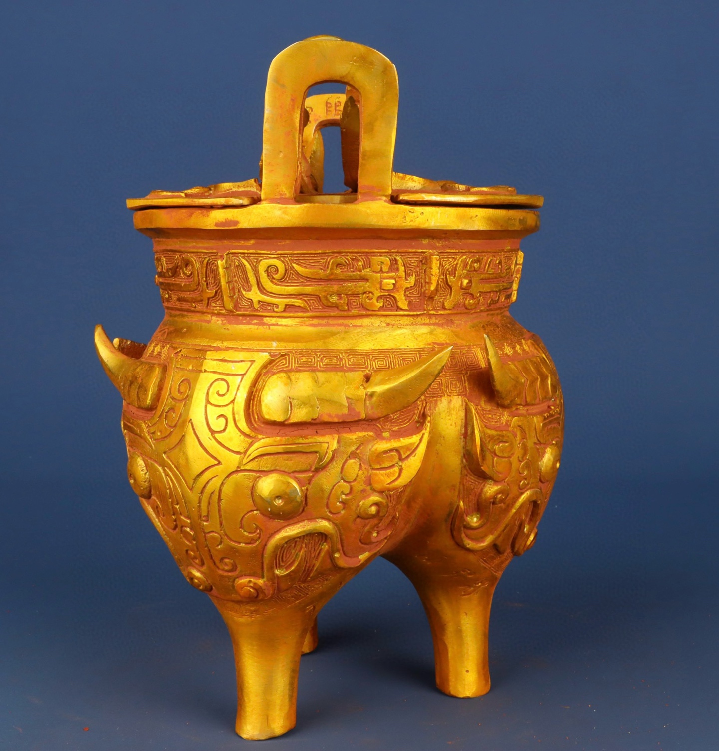 Zhou Dynasty Bronze gilt animal faced tripod