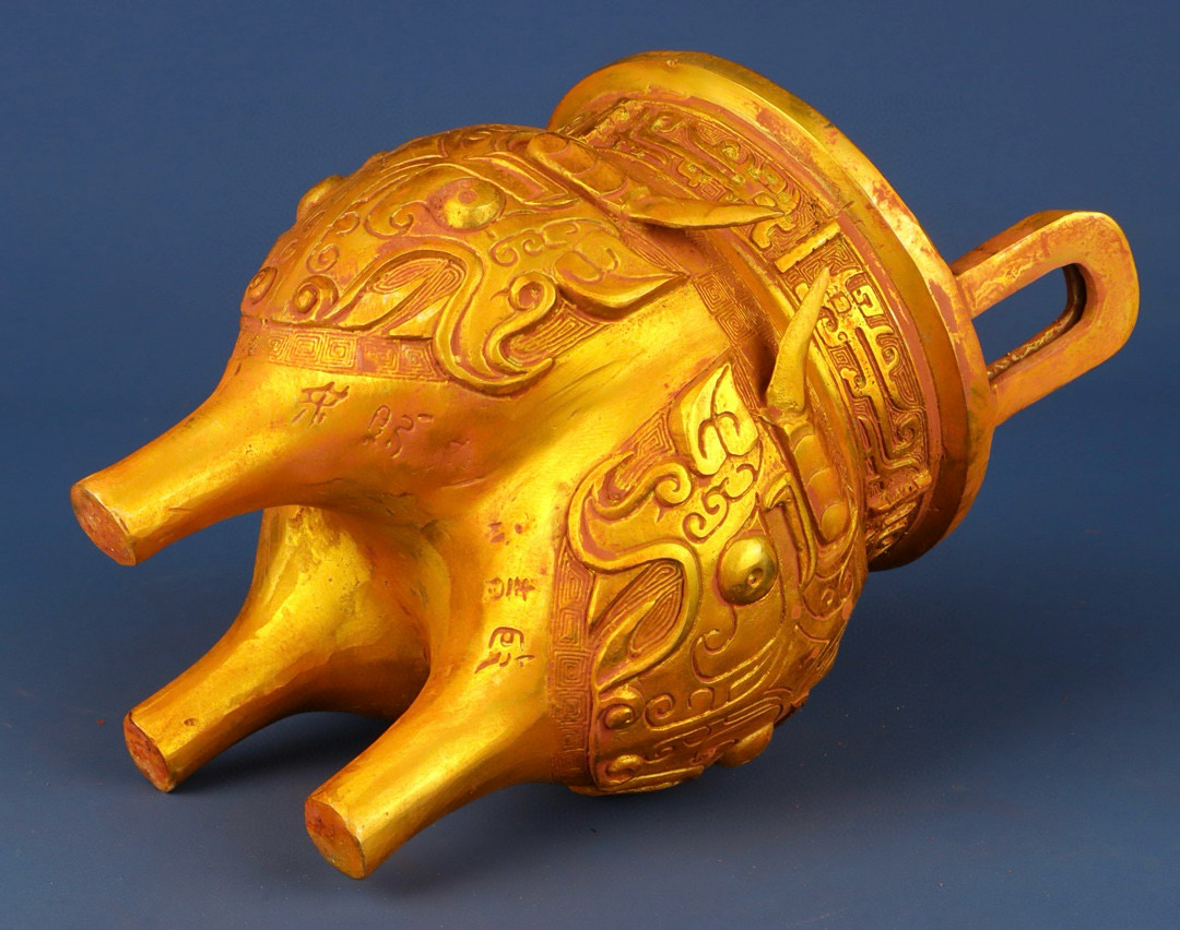 Zhou Dynasty Bronze gilt animal faced tripod