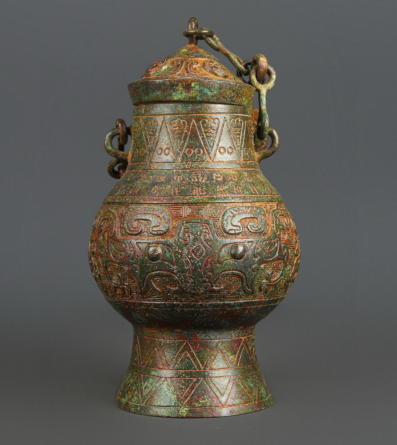 Zhou Dynasty Bronze animal face chain bottle