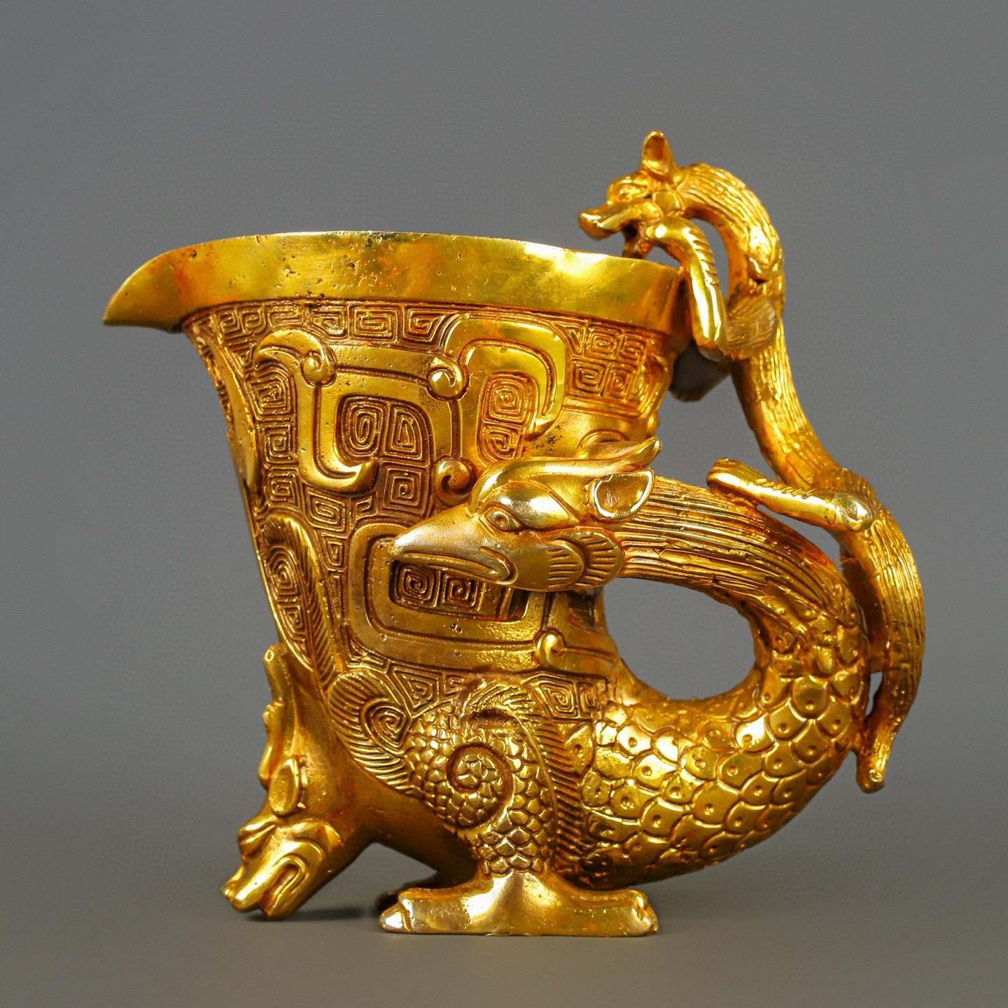 Han Dynasty gilt bronze dragon and phoenix cup