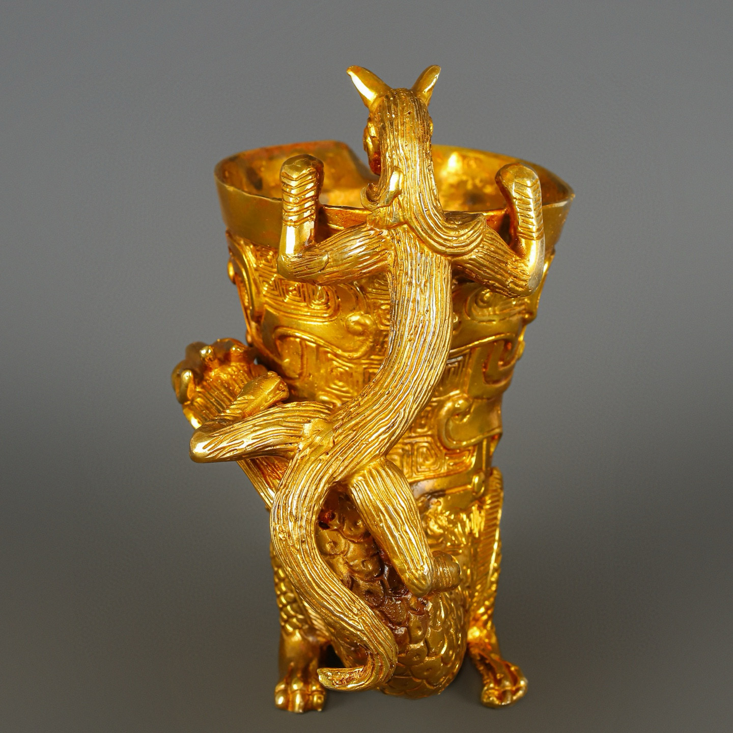 Han Dynasty gilt bronze dragon and phoenix cup