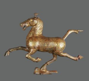 Han Dynasty Bronze and gold horses stepping on flying swallows