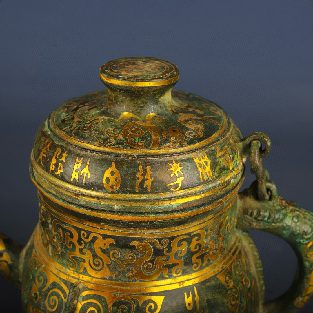 Han Dynasty Bronze and gold stitched beam raised teapot