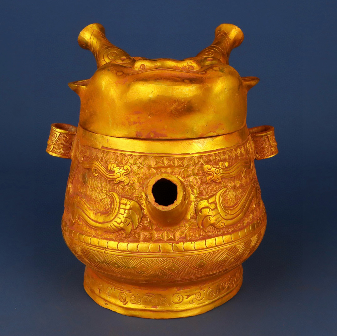Zhou Dynasty Bronze gilt human face pot