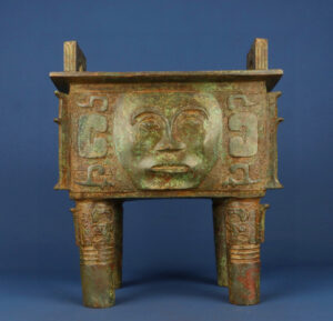 Zhou Dynasty Bronze human faced square tripod