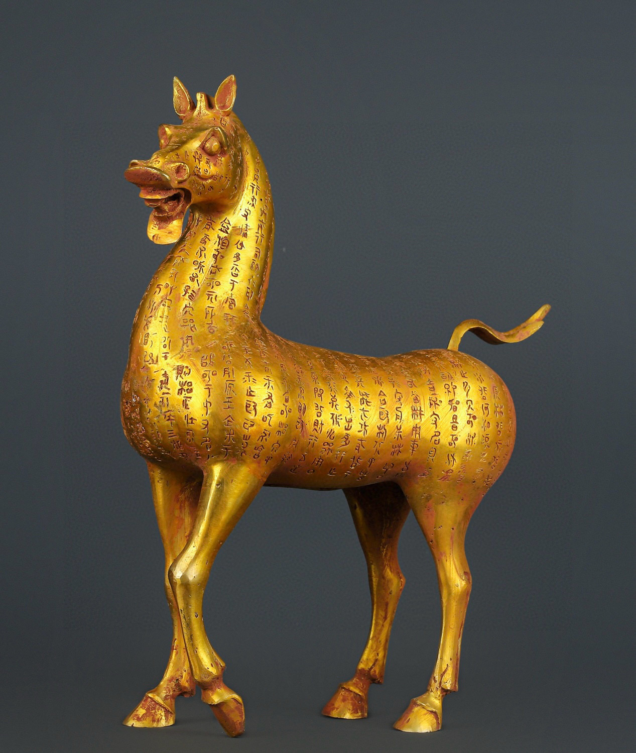 Han Dynasty gilt bronze horse with inscriptions