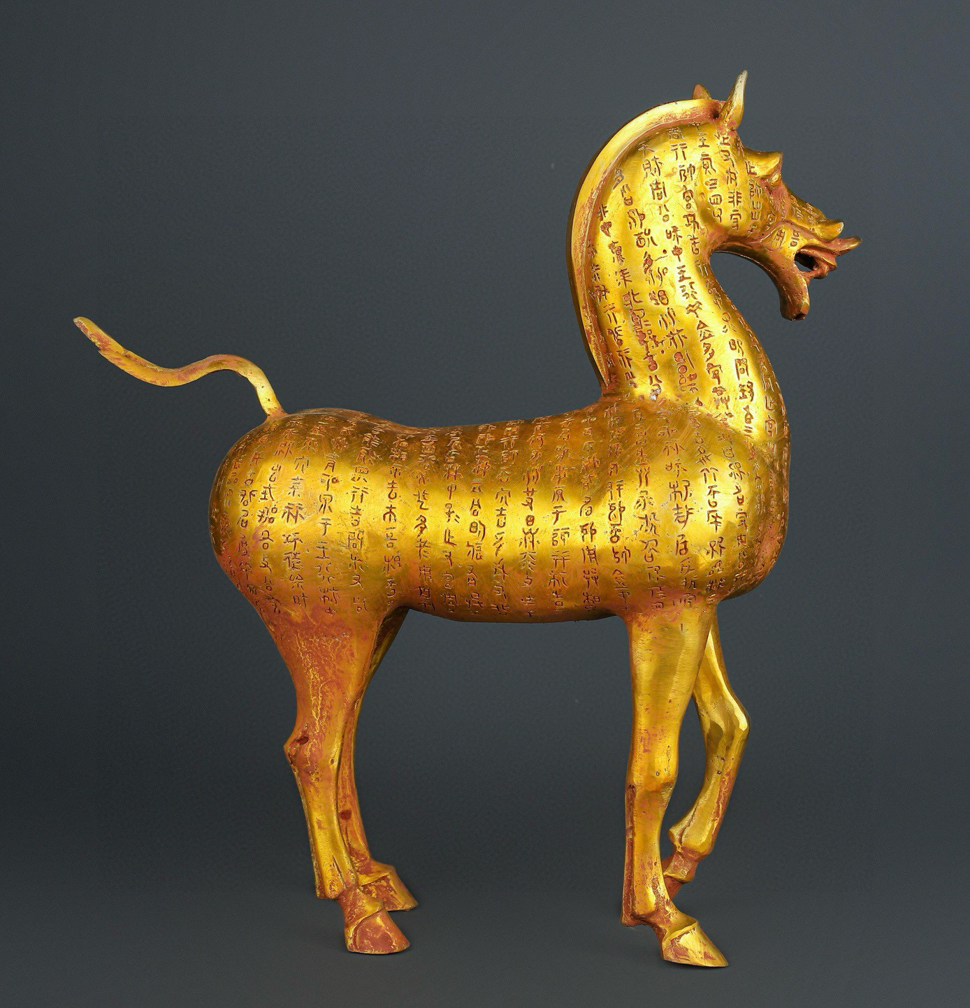 Han Dynasty gilt bronze horse with inscriptions