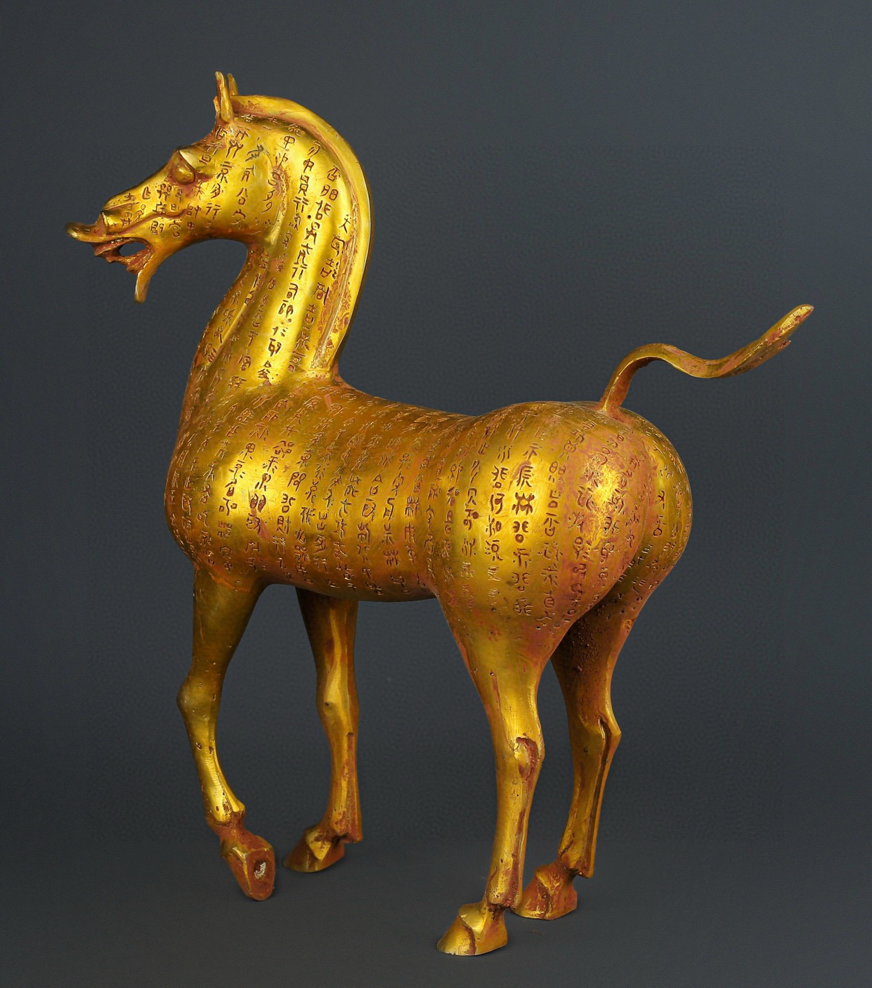 Han Dynasty gilt bronze horse with inscriptions