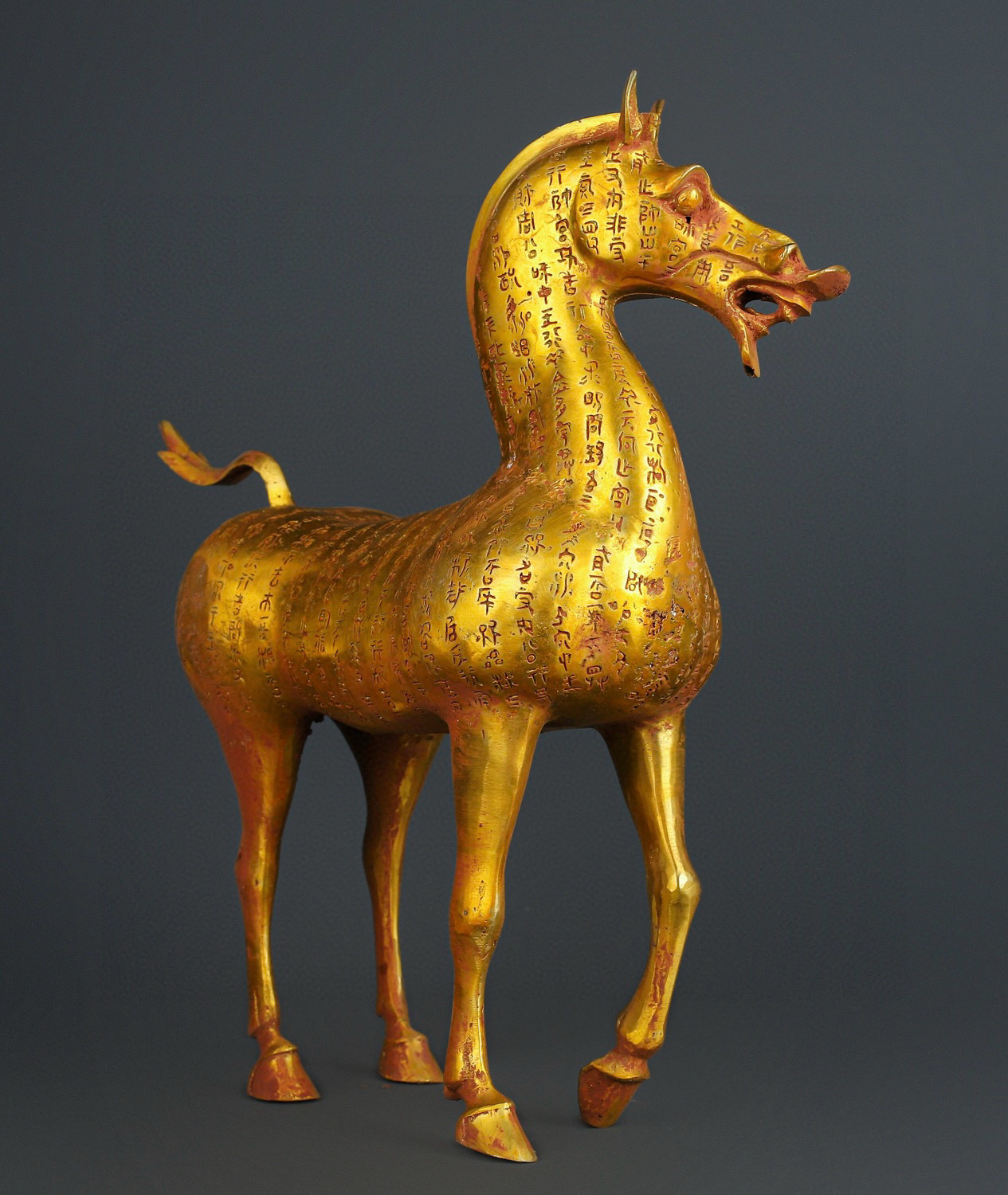 Han Dynasty gilt bronze horse with inscriptions