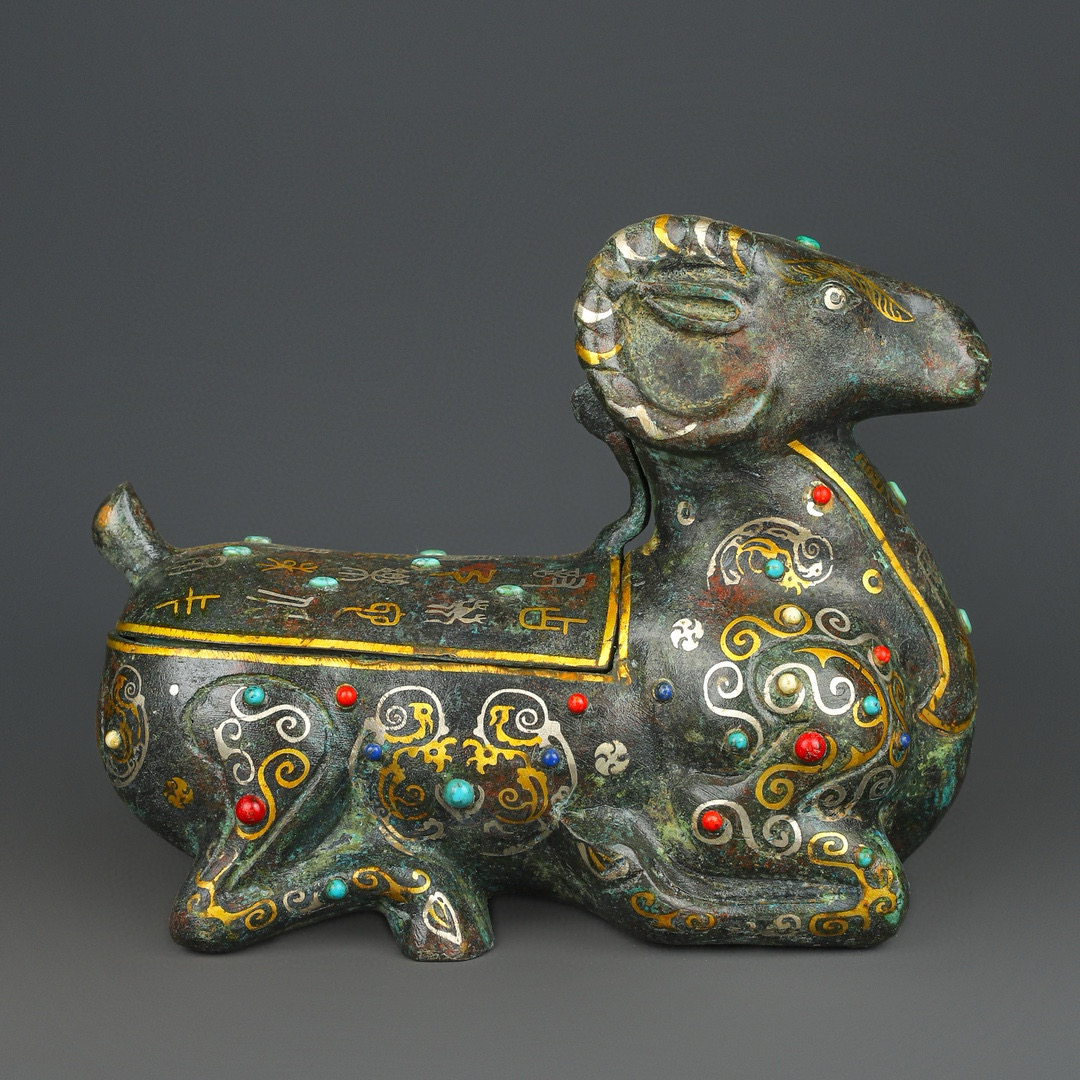 Han Dynasty Bronze with gold and silver inlaid with multiple precious stones lying on the sheep