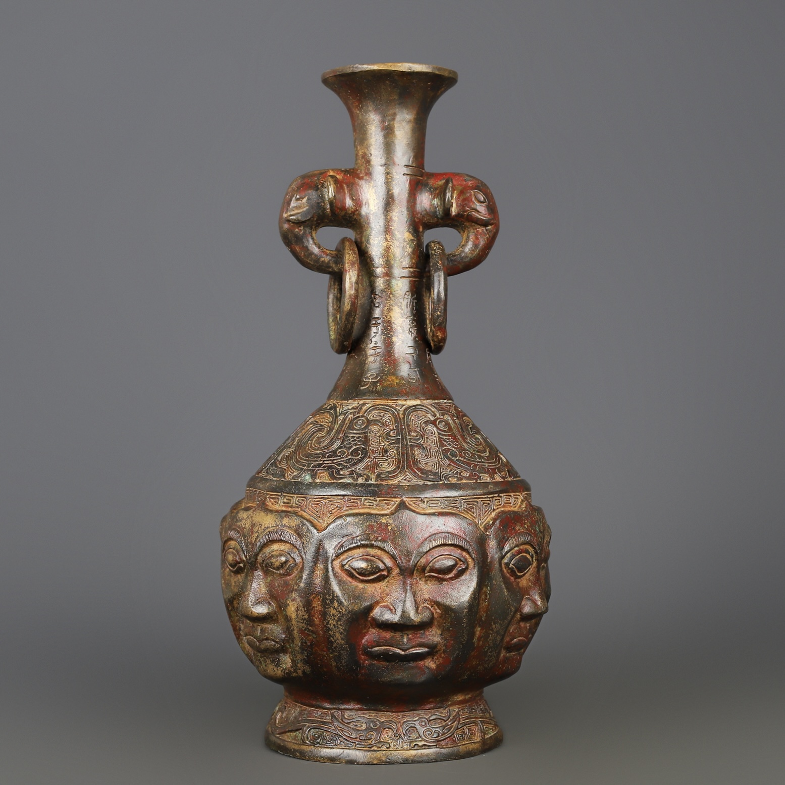 Zhou Dynasty Bronze Human Face Vase