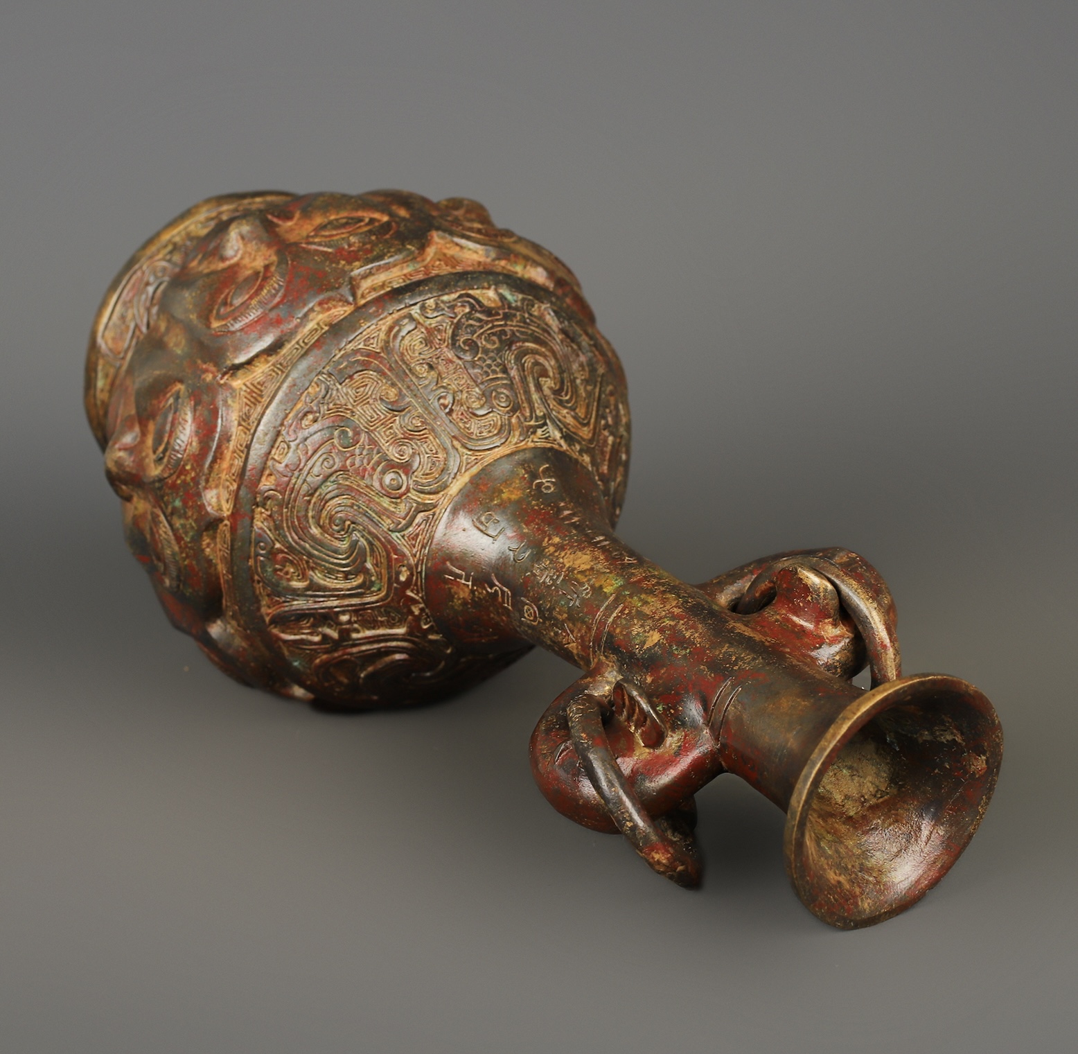 Zhou Dynasty Bronze Human Face Vase