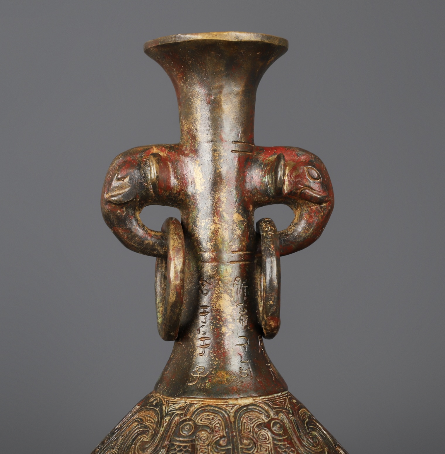 Zhou Dynasty Bronze Human Face Vase
