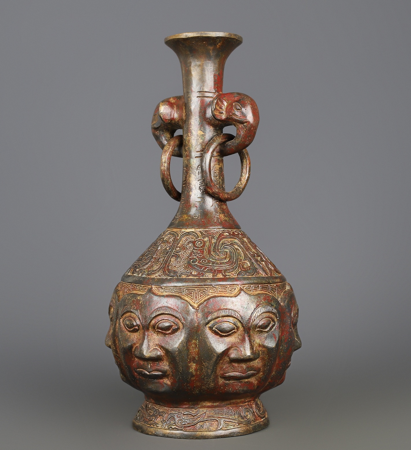 Zhou Dynasty Bronze Human Face Vase