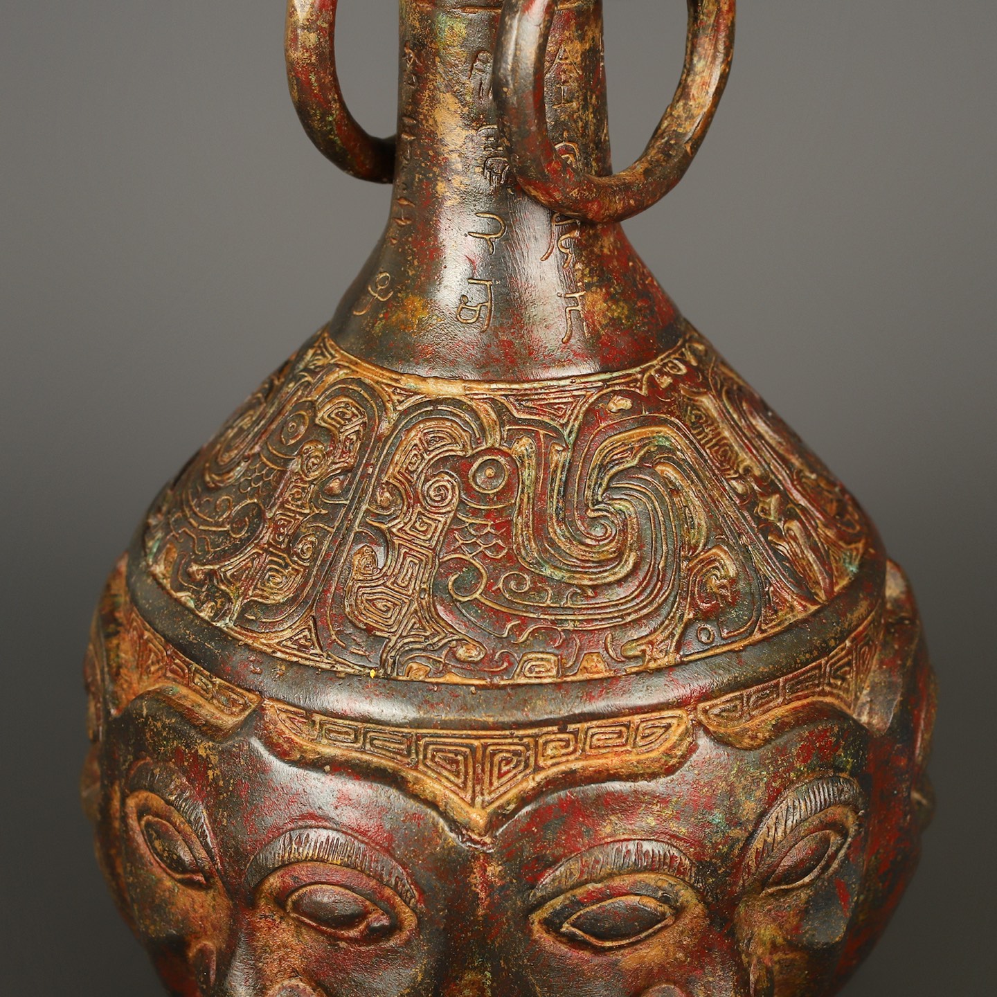 Zhou Dynasty Bronze Human Face Vase