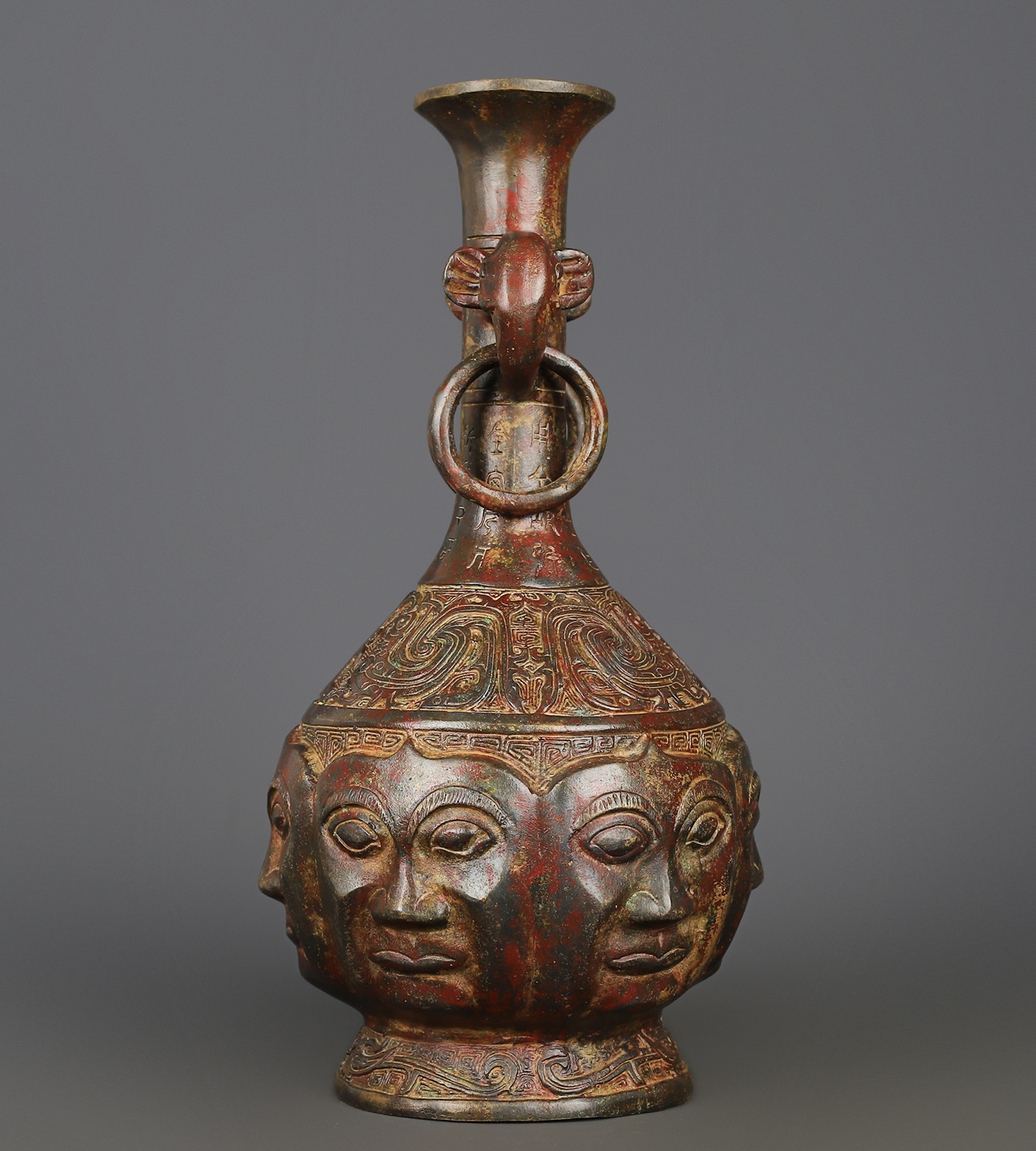 Zhou Dynasty Bronze Human Face Vase