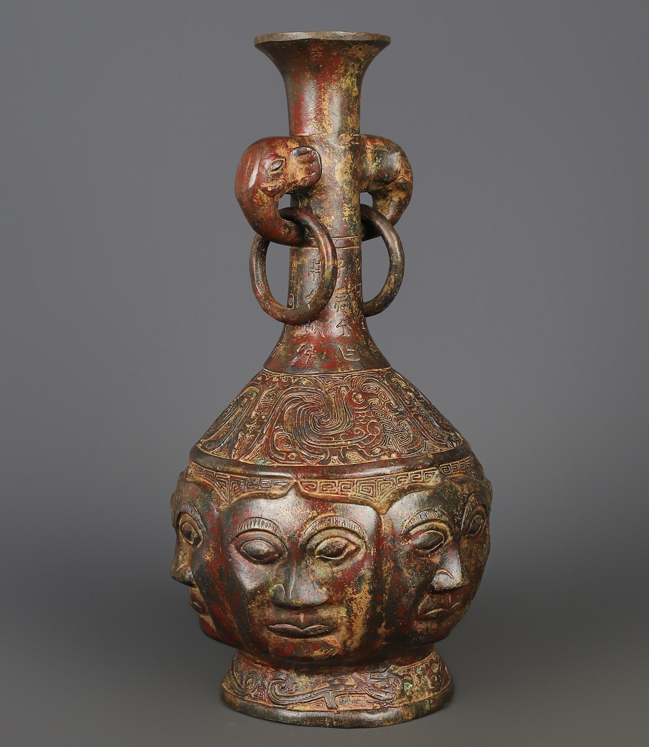 Zhou Dynasty Bronze Human Face Vase