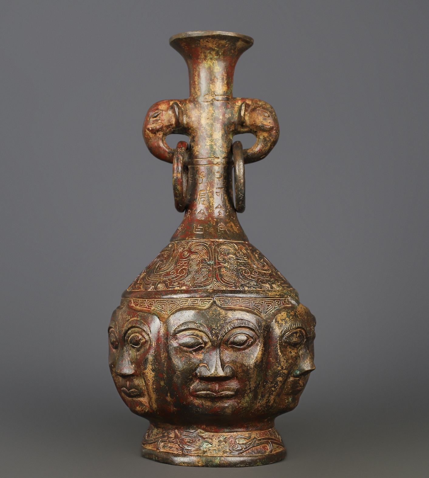 Zhou Dynasty Bronze Human Face Vase